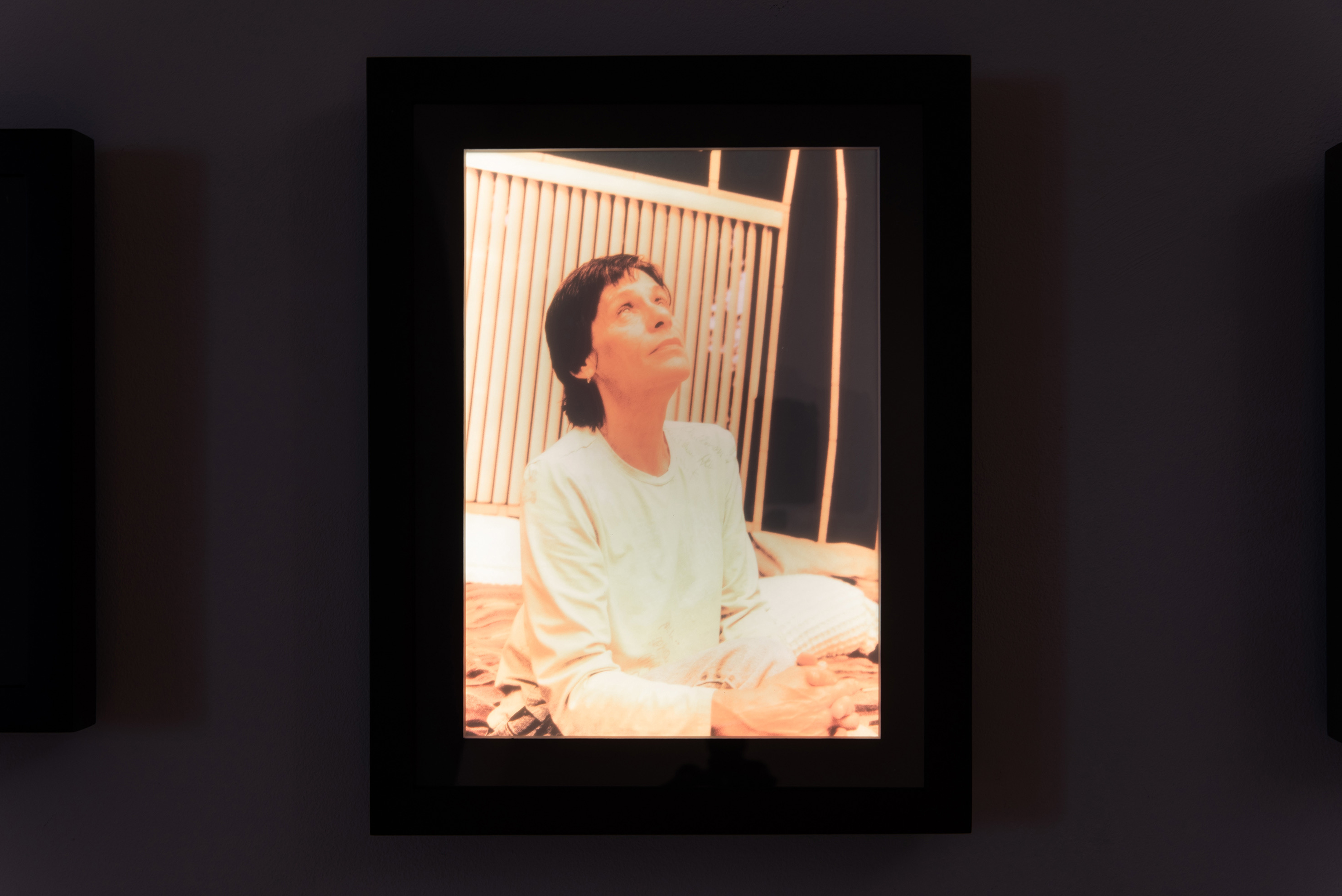 "Althea in her bedroom II," 2008 (printed 2022), transparency in LED lightbox, 12" x 9" x 1"