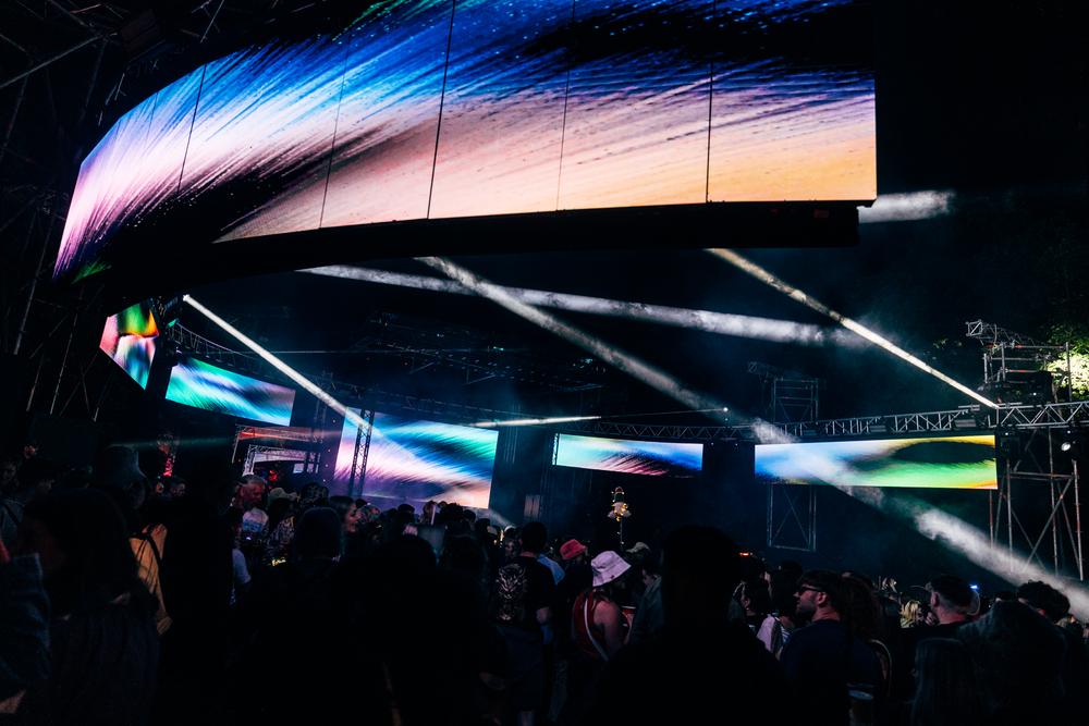 Max Cooper performing immersive live audiovisual show at AVA x Smirnoff IMMERSE stage