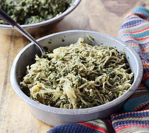 a tasty looking bowl of spaghetti squash with pesto
