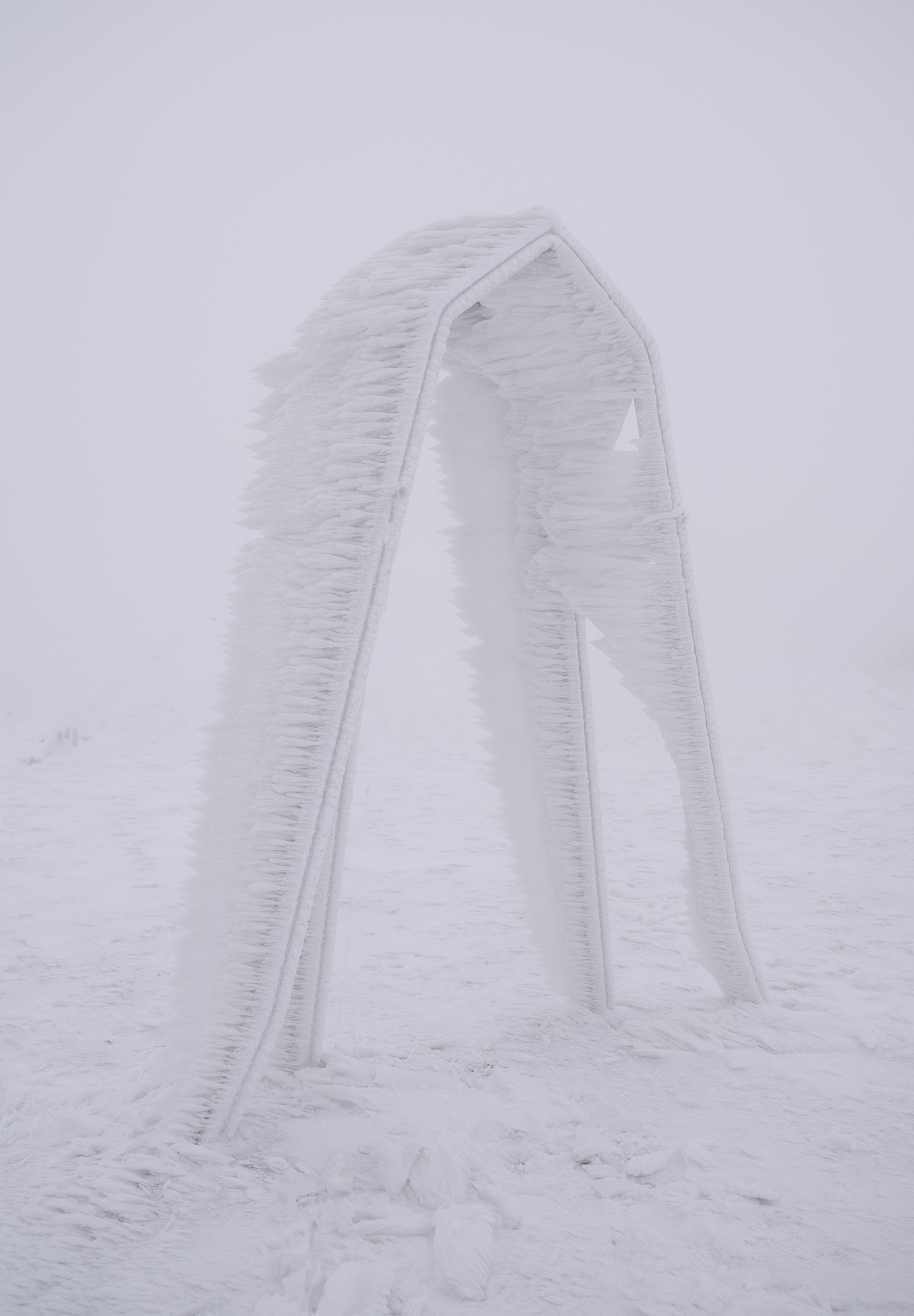 Merope, the lost Pleiade, 2022.   recycled aluminium, snow patina, frost and ice. 2.5 m tall. 