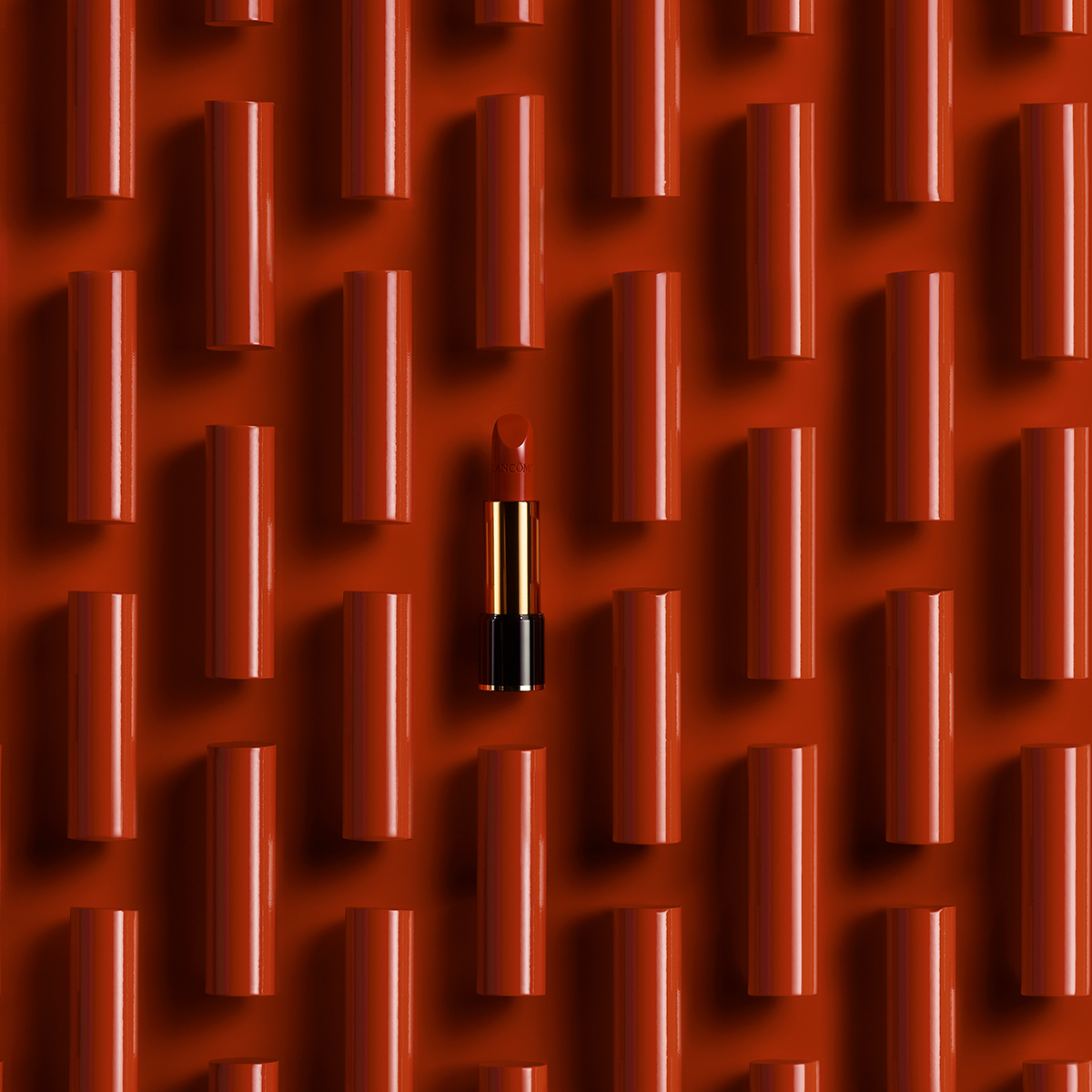 KMA photographer Isabelle Bonjean shoots several silky and creamy lancome lip stick bottles 