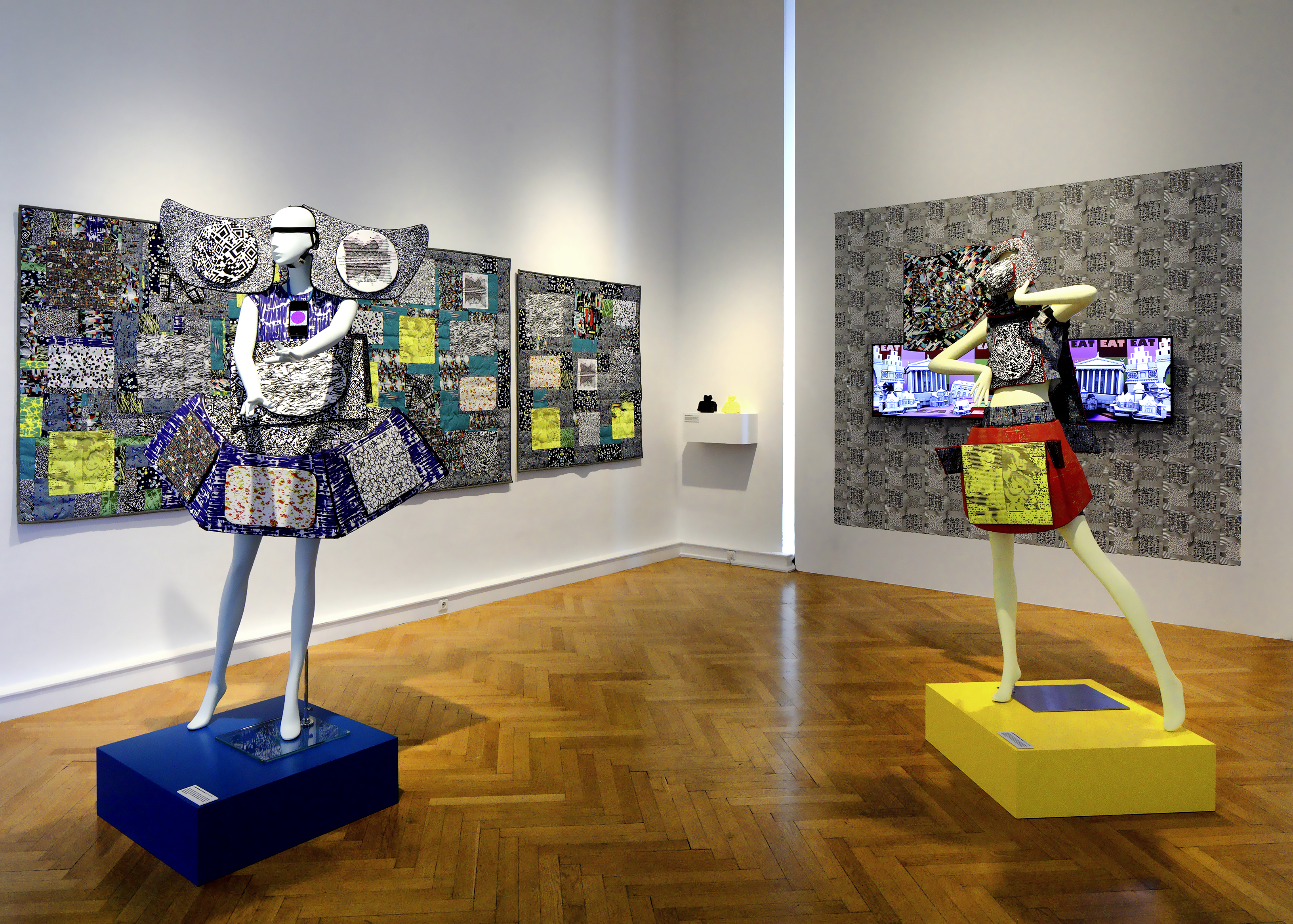 Claudia and Julie Website Dresses (2013-2014), made from augmented trackable custom fabric,  using dye sublimation computer printed polyester canvas, mounted on EVA foam, hand-sewn and  glued, and implementing the web-based Alices App triggered by QR, to display text animations of  the Alice’s Walking libretto; Blue Ascii Girls Quilt, Big Crazy Quilt; Nayland Split Square Quilt (all  2014), also made from augmented trackable custom fabric, using dye sublimation computer printed  polyester canvas, also mounted on EVA foam, and hand-quilted by using a mechanical plastic  labeling tool, and also implementing the web-based Alices App, triggered by QR to display text  animations of the Alice’s Walking libretto, and made using Adobe After Effects; Black and Yellow  Princess Dresses (2016), using 3D computer files hand-modeld by the artist, using Maya animation  software then rapid-prototype printed from Acrylonitrile Butadiene Styrene plastic; The Dolls (2016),  2-channel ten-minute loop, made using Maya 3D animation software, music by Kurt Hentschläger,  mounted on Alice XR custom web-based augmented-reality wallpaper.