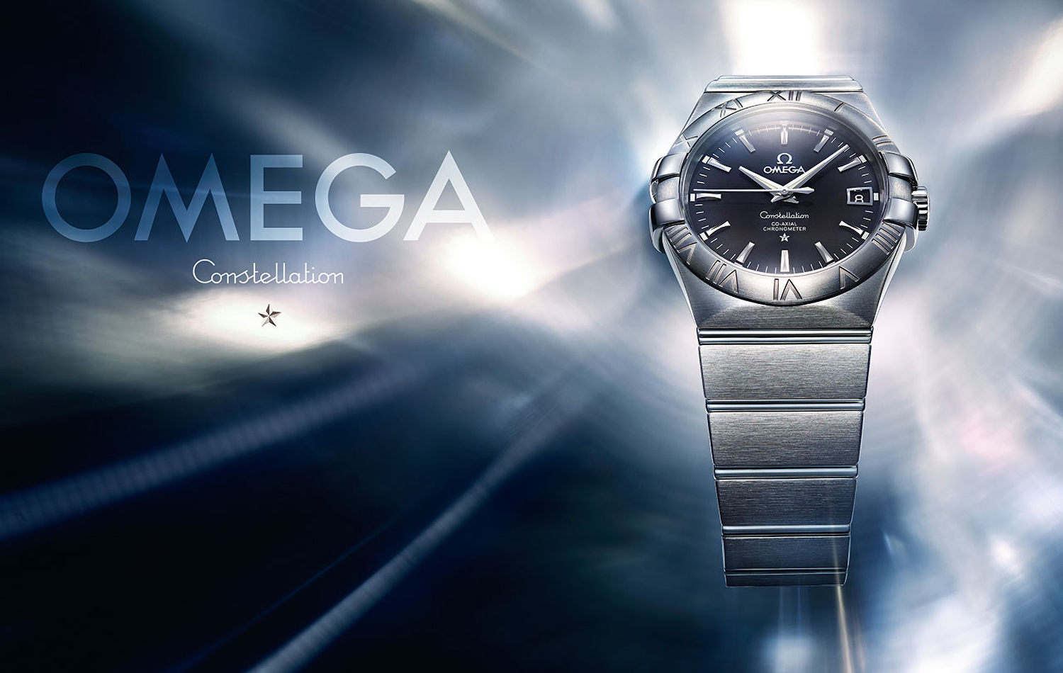 KMA photographer Daniel Schweizer photographs a silver and blue watch for Omega against a shiny blue background 