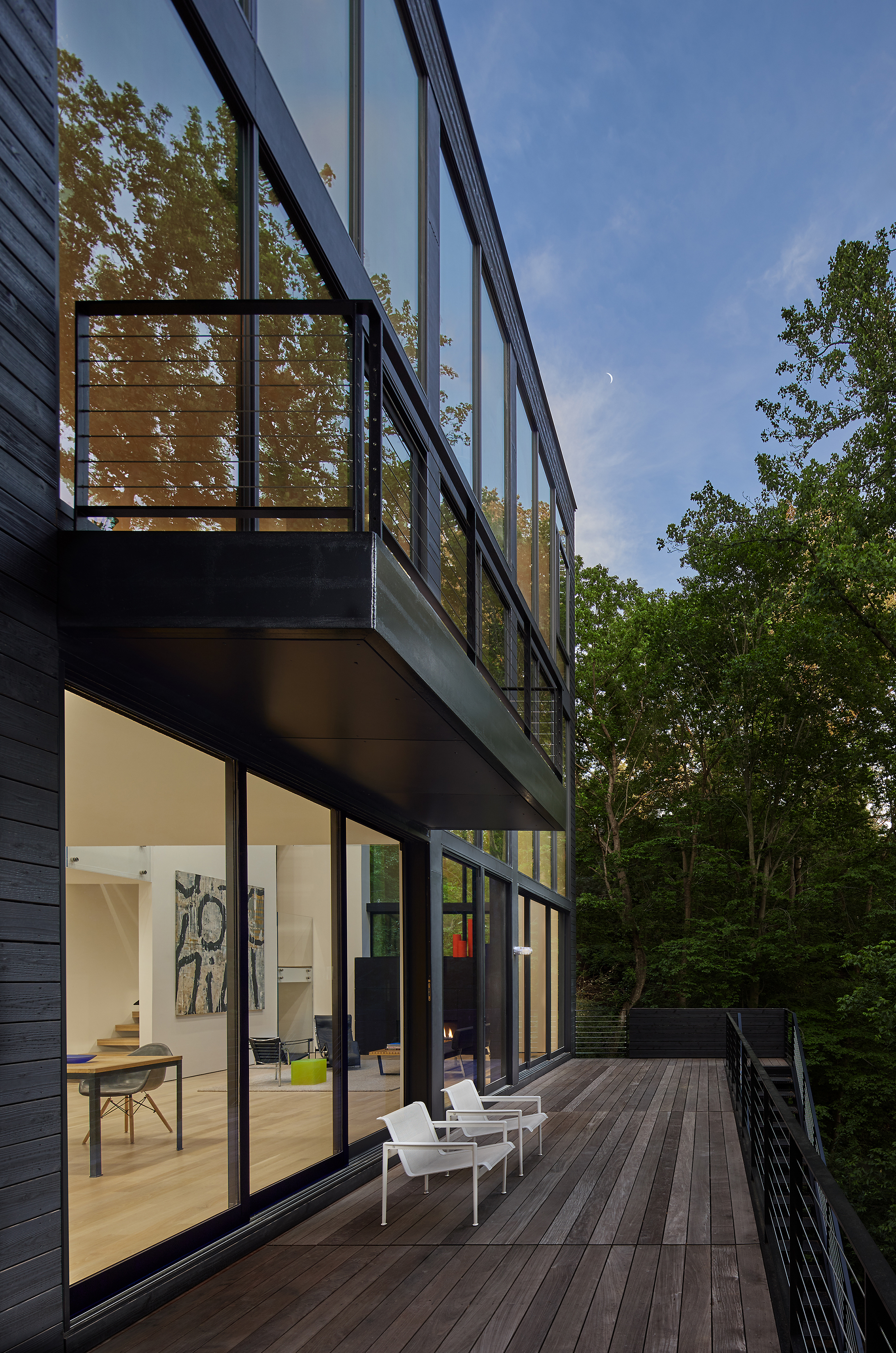 Decks and balconies create outdoor living spaces at the rear of the house