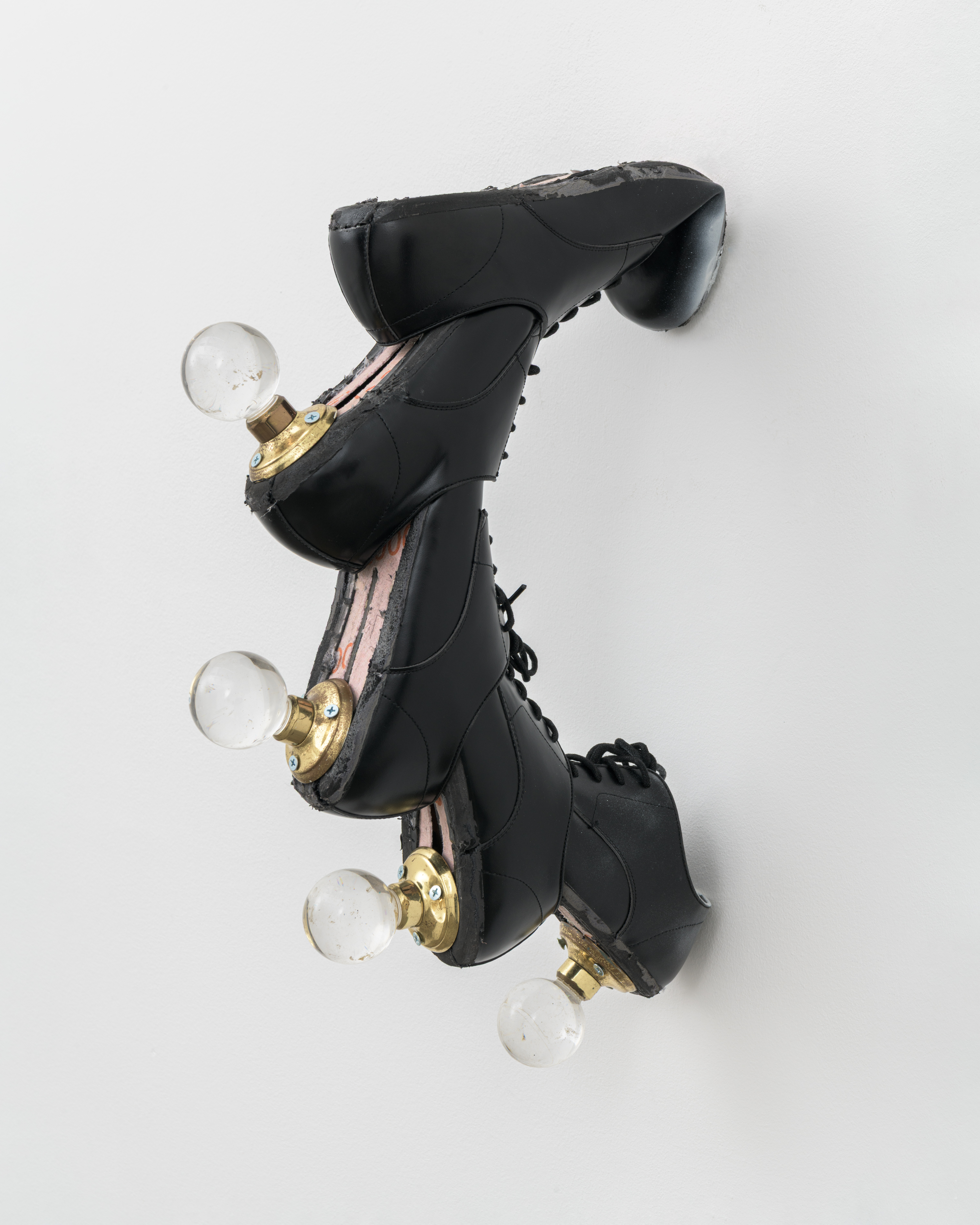 Lengthening I, 2025, Leather dress shoes, spray paint, glass door handles 11.5 cm x 50.5 cm x 36 cm