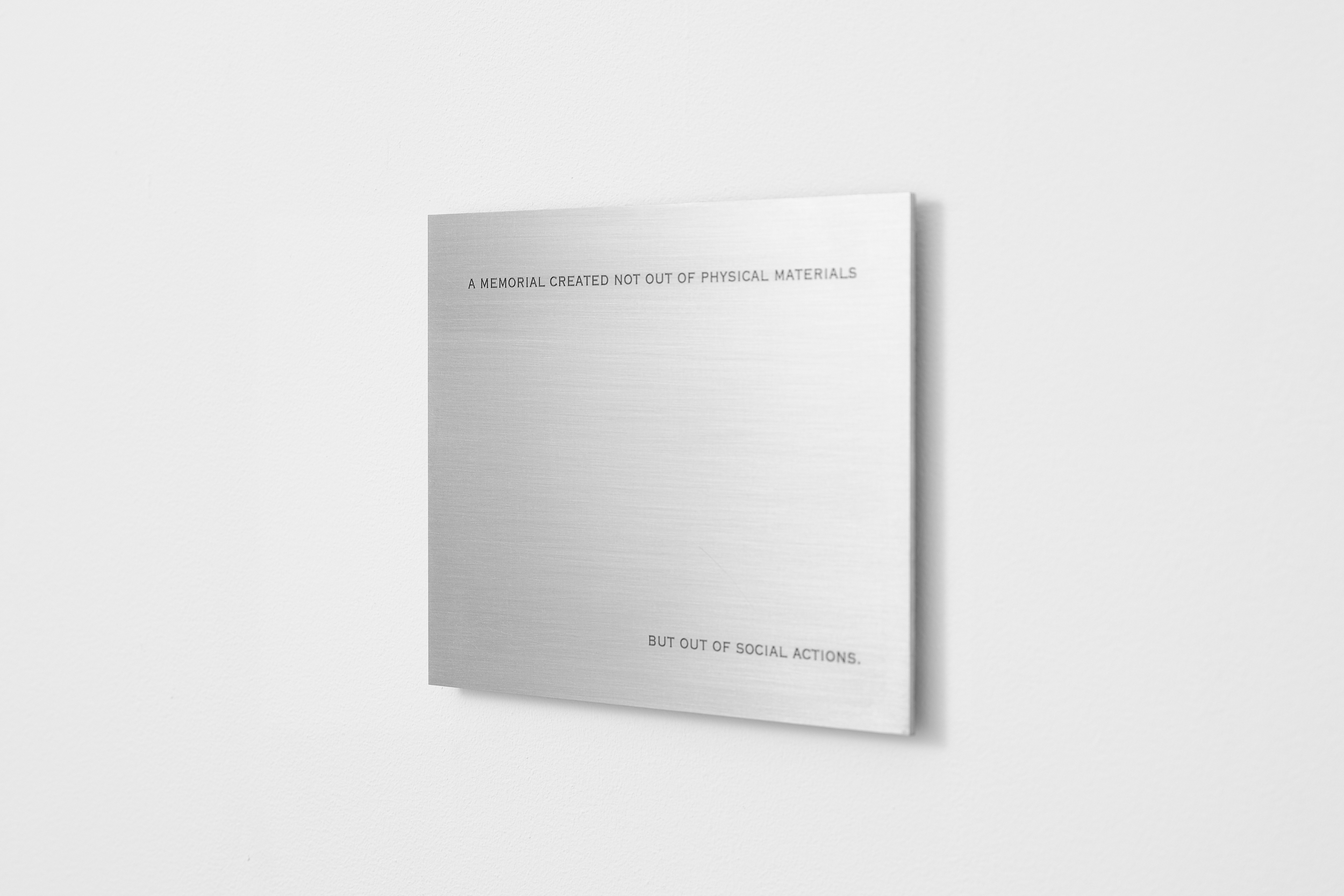 James Webb, A memorial created not out of physical materials but out of social actions (2025) | Text, engraved stainless steel, magnets, 12 x 18 x 0,2 cm