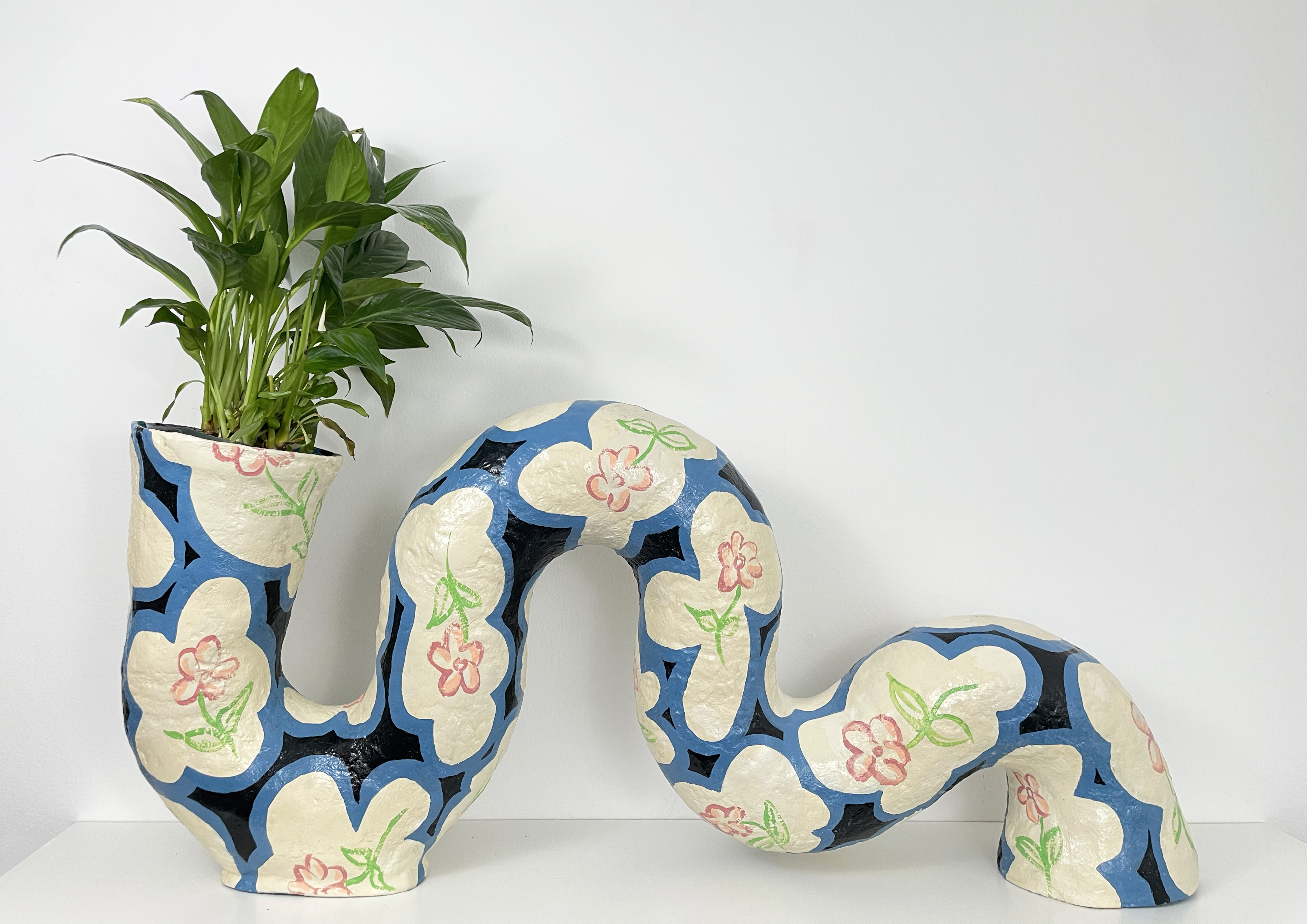 Blossom, paper clay, acrylic paint, peace lily, 15.5” x 32” x 6”, 2023