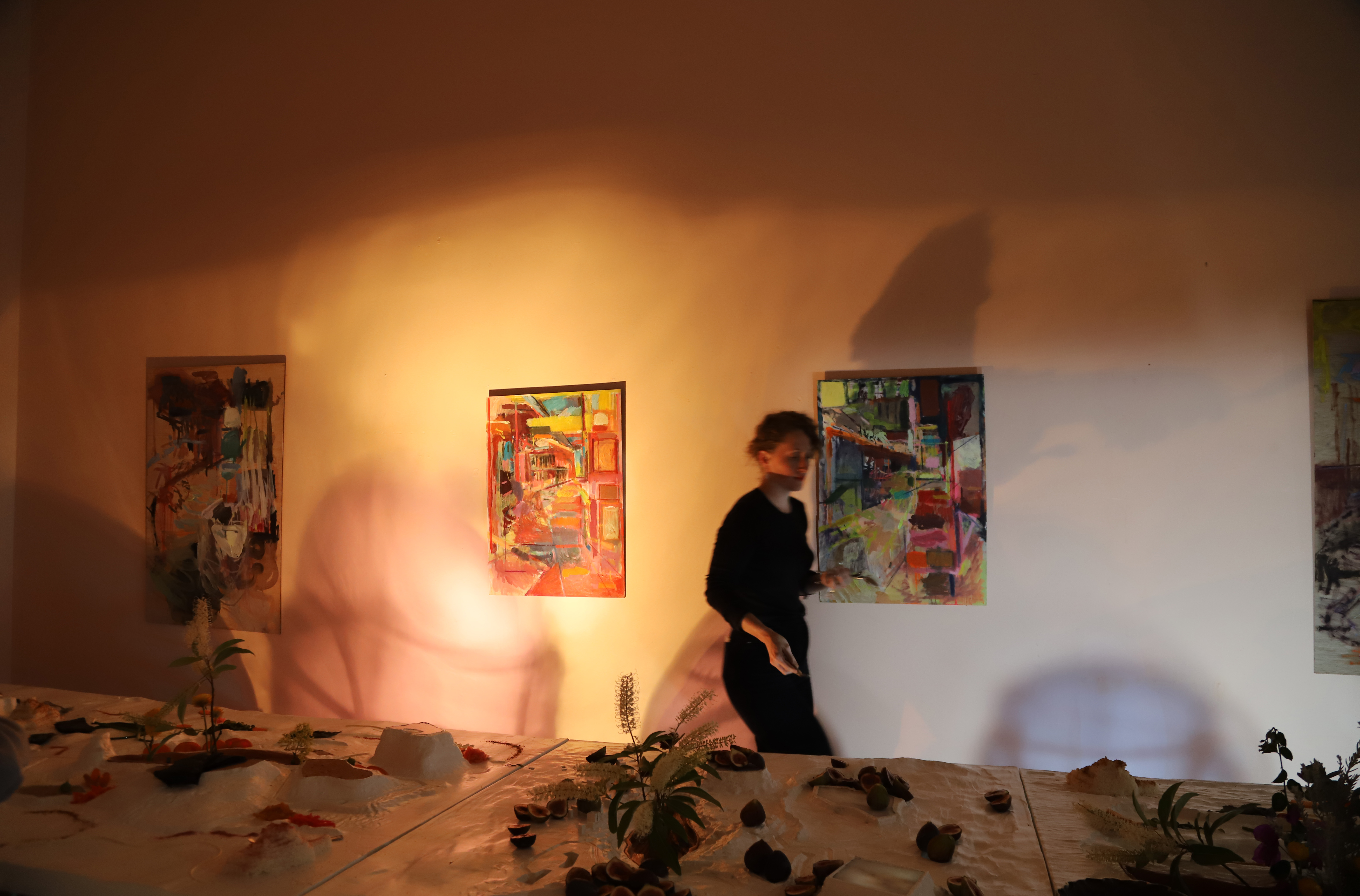 TableTerrain set for Closing Party with Babu's throwing coloured shadow onto paintings by Stephanie Eather.