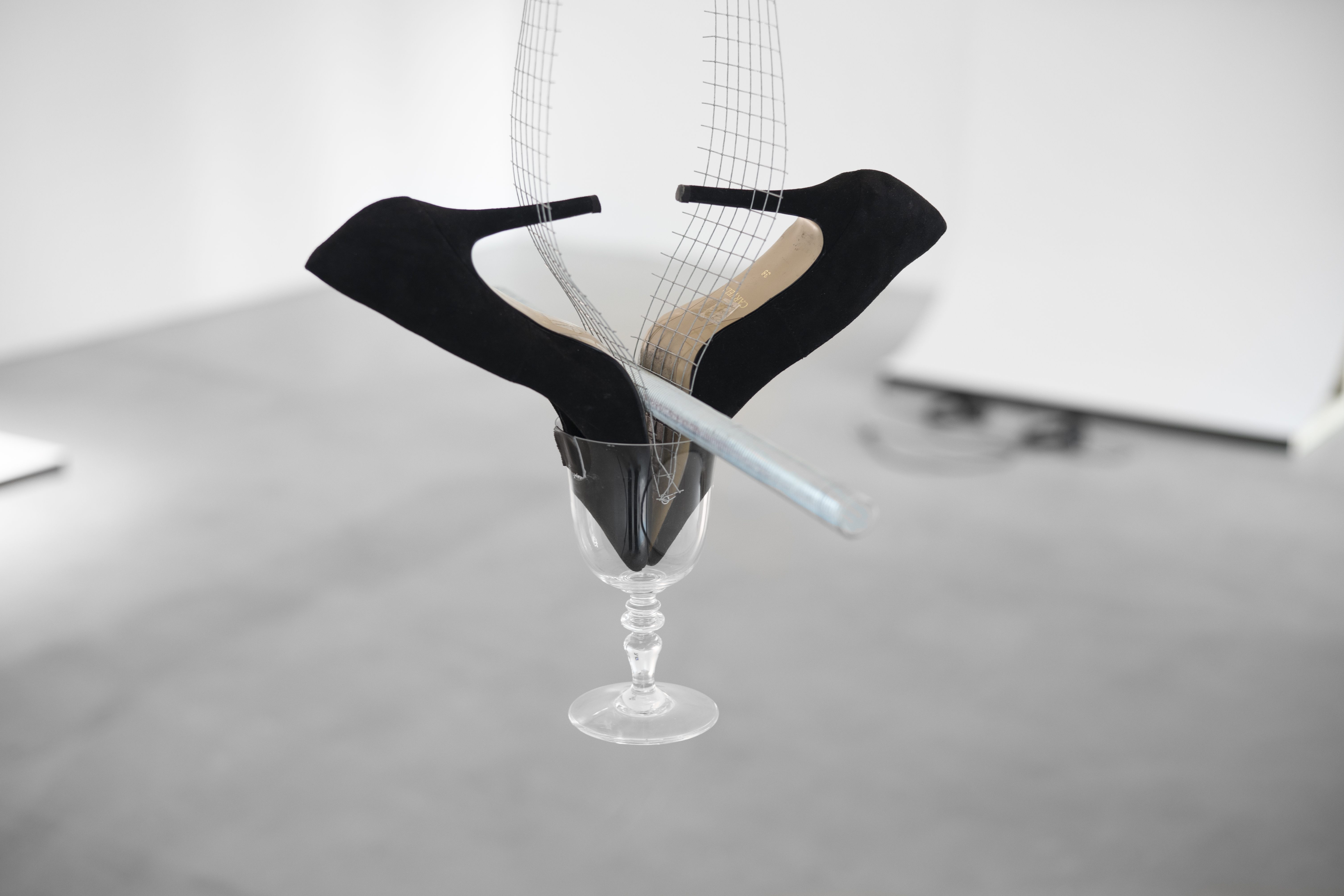 Ring II, 2022, High heels, Wine Glass, Threaded rod, Wire Mesh, Tape. dimensions variable