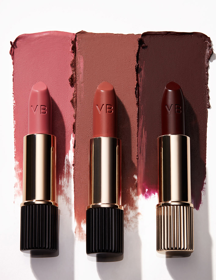 KMA stylist Rachel Haas designs set for photograph of smeared shades of lipstick on white background for Victoria Beckham