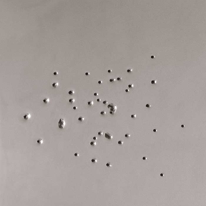 Los Lunas #12, 2005, stainless steel with gunshot, 46x46