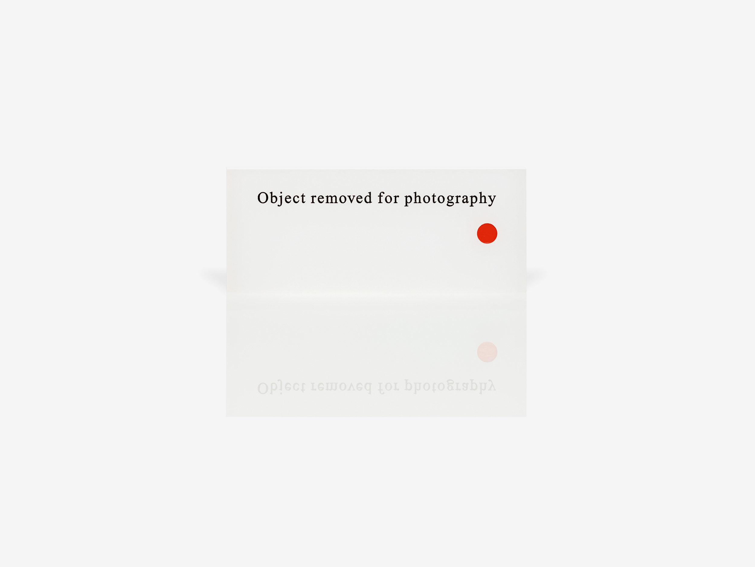 Object Removed for Photography 2008 Frost white acrylic with black engraved text and red dot 5 × 12 × 0.5 cm Edition of 10 In collaboration with Peter Saville Rob Tufnell London (19 September – 25 October 2014)