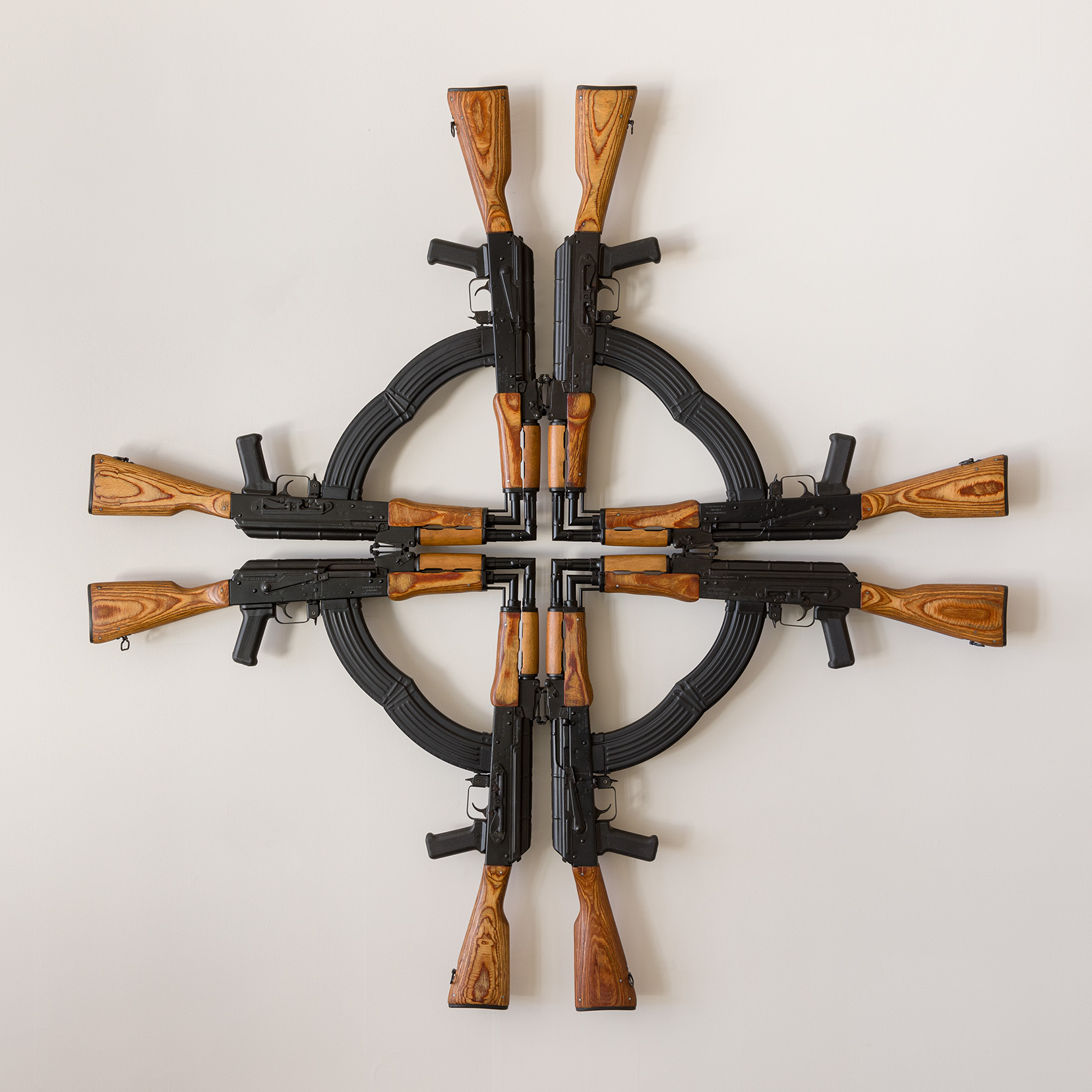 Mel Chin, "Cross for the Unforgiven," 2002, AK-47 assault rifles (cut and welded), 54 x 54 x 3 inches. Photo by Etienne Frossard. 