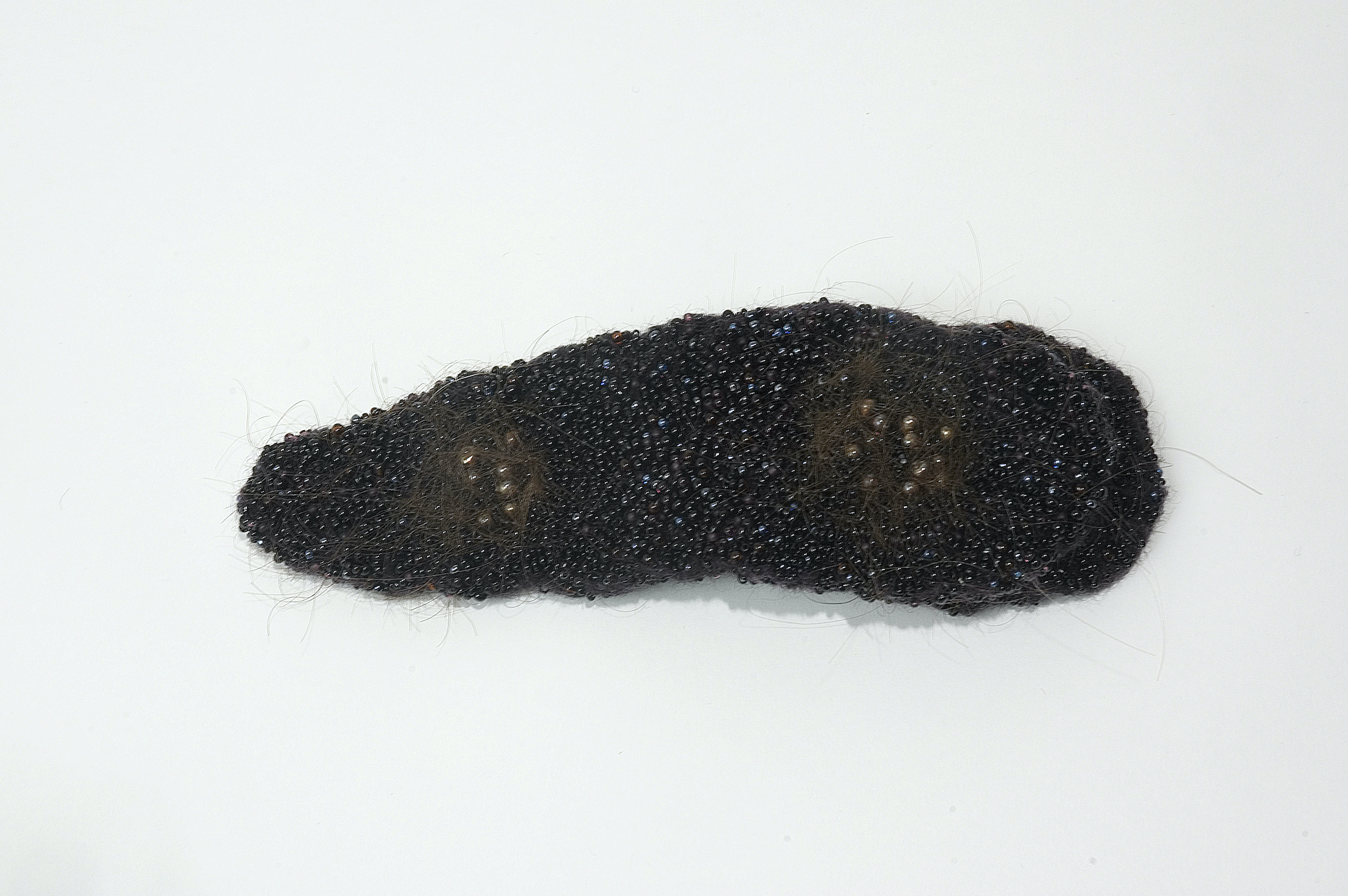  Negros, 2004 . Hand made felt and hair embroidered with glass beads . 20 cm . Private Collection Amsterdam, The Netherlands