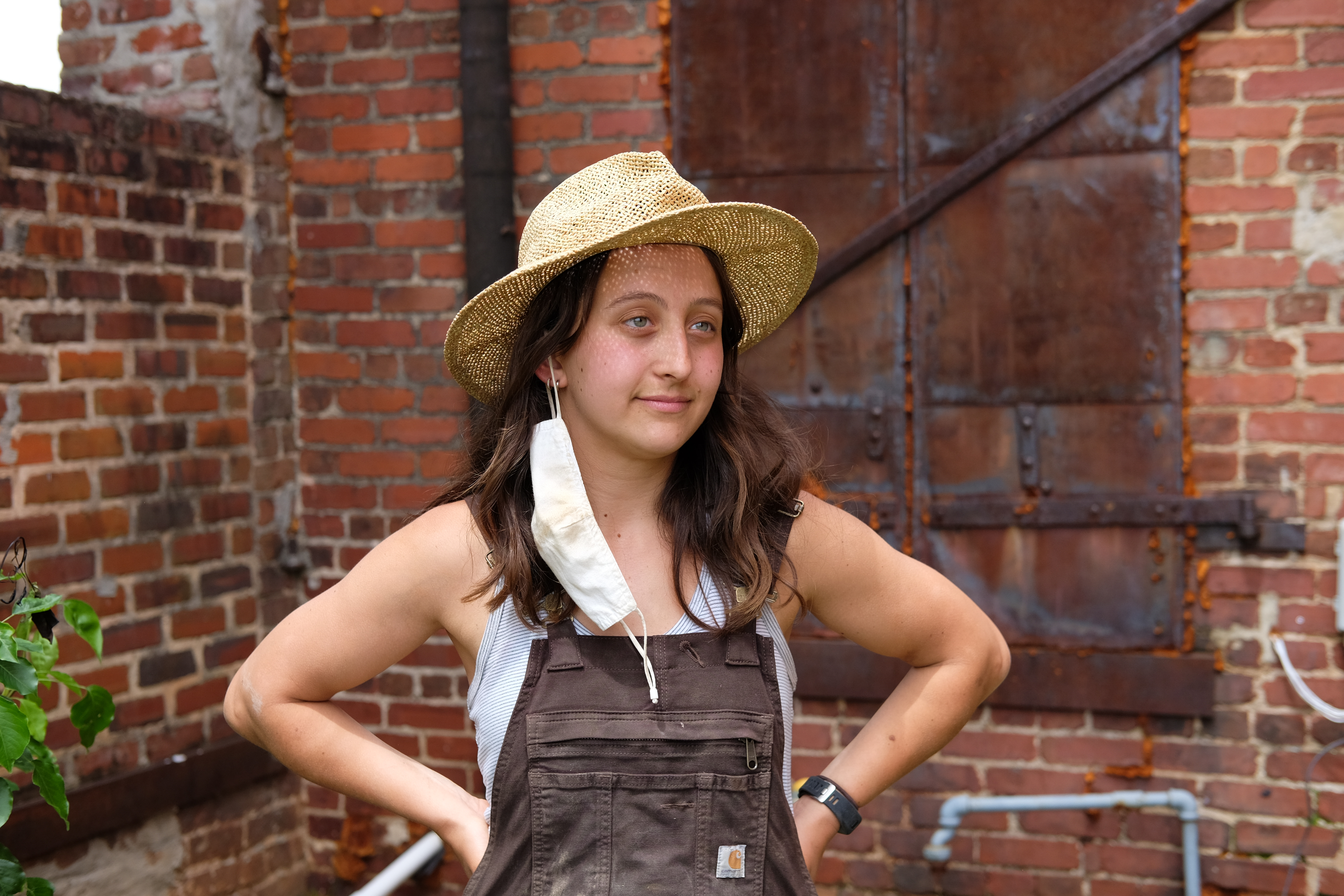 Addie, 23, takes a break from a construction project in Greensboro, AL. She's a fifth-year architecture student in Auburn's Rural Studio program.
