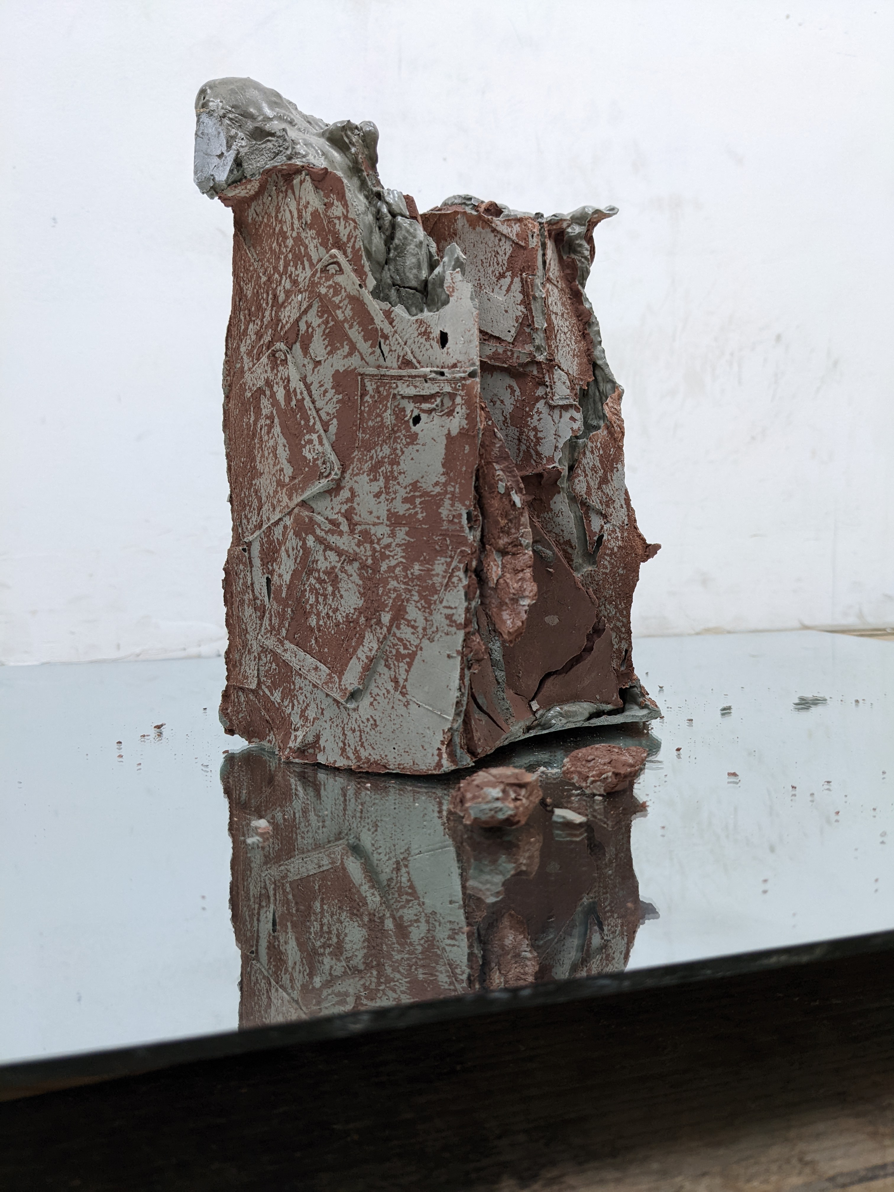 Cement Cast, of 35mm slides, red raw clay, mirror, 2021