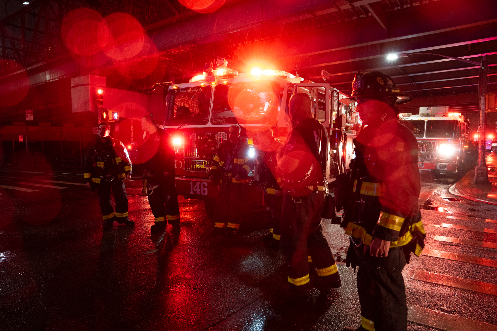 Firefighters stand on Bedford Ave. after putting out a fire at the Moxy Hotel in Williamsburg, Brooklyn. Dec. 11, 2024.