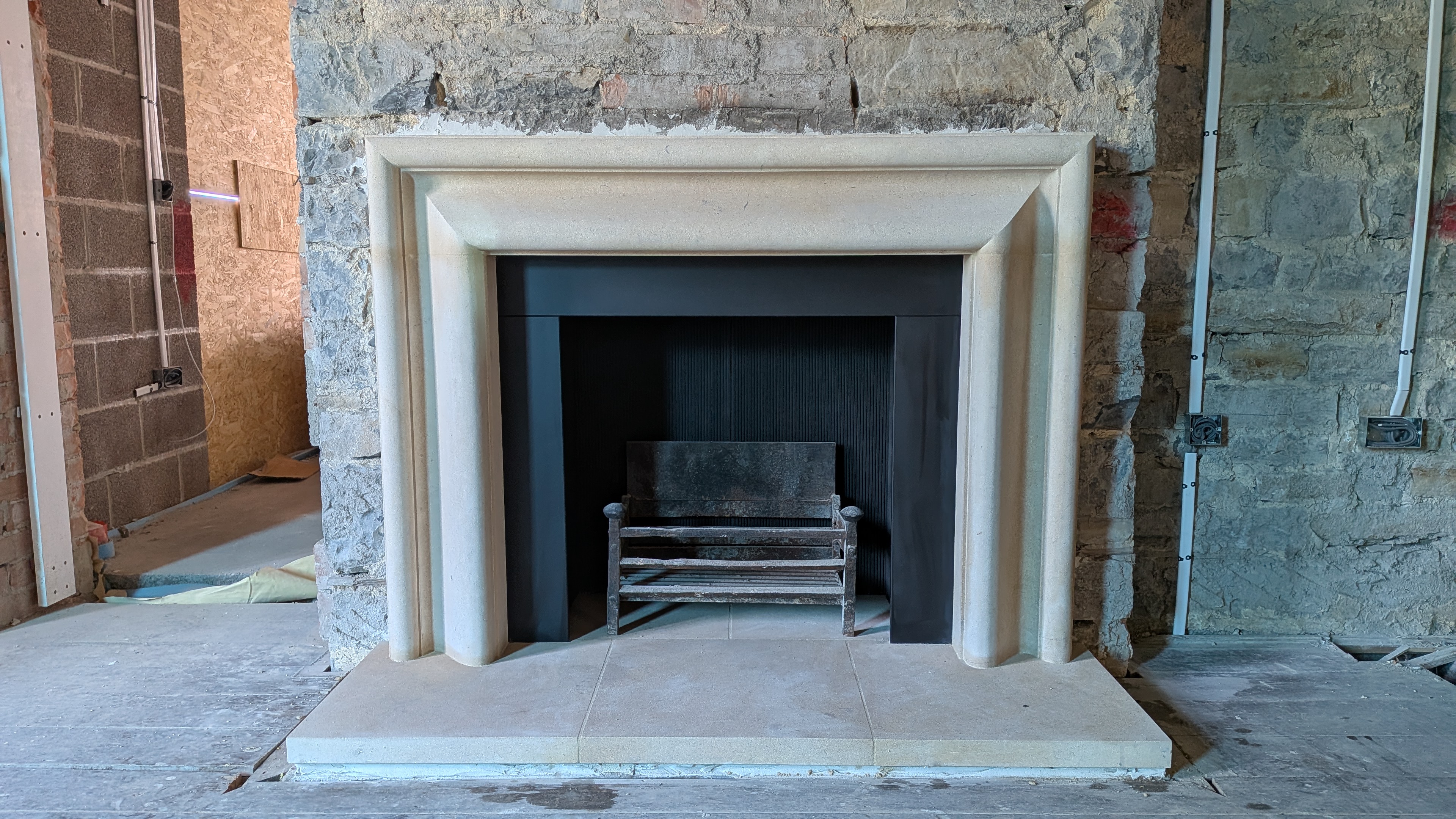 Hampstead Bolection in Bath stone with slate slips