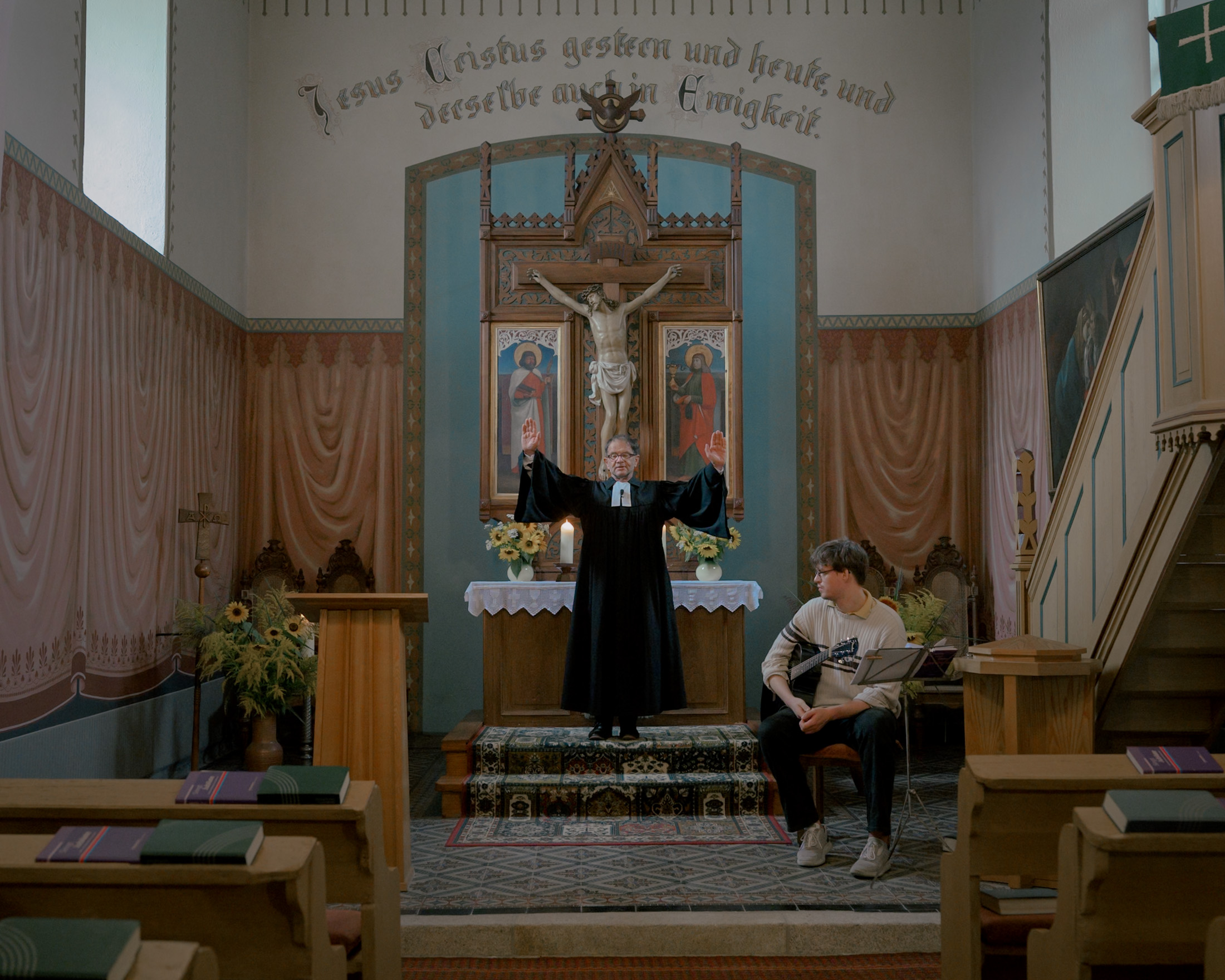 Pastor Andreas Fünfstück and musician Johann Schulz during the blessing in the service at the church in Tetta, Germany on August 25, 2024. Four visitors from the village came to the service. The Christian church has a difficult standing in Saxony due to its socialist past. Some pastors choose not to take a political stance so as not to upset their congregation, unlike Pastor Fünfstück, who prayed for democracy, candidates, and voters during the service. In his sermon on charity, he commented on the AfD's election campaign event at the Deutsche Eiche restaurant in Tetta a few days earlier and asked: "What if as many people came to the church service as came to the Deutsche Eiche restaurant on Tuesday?"