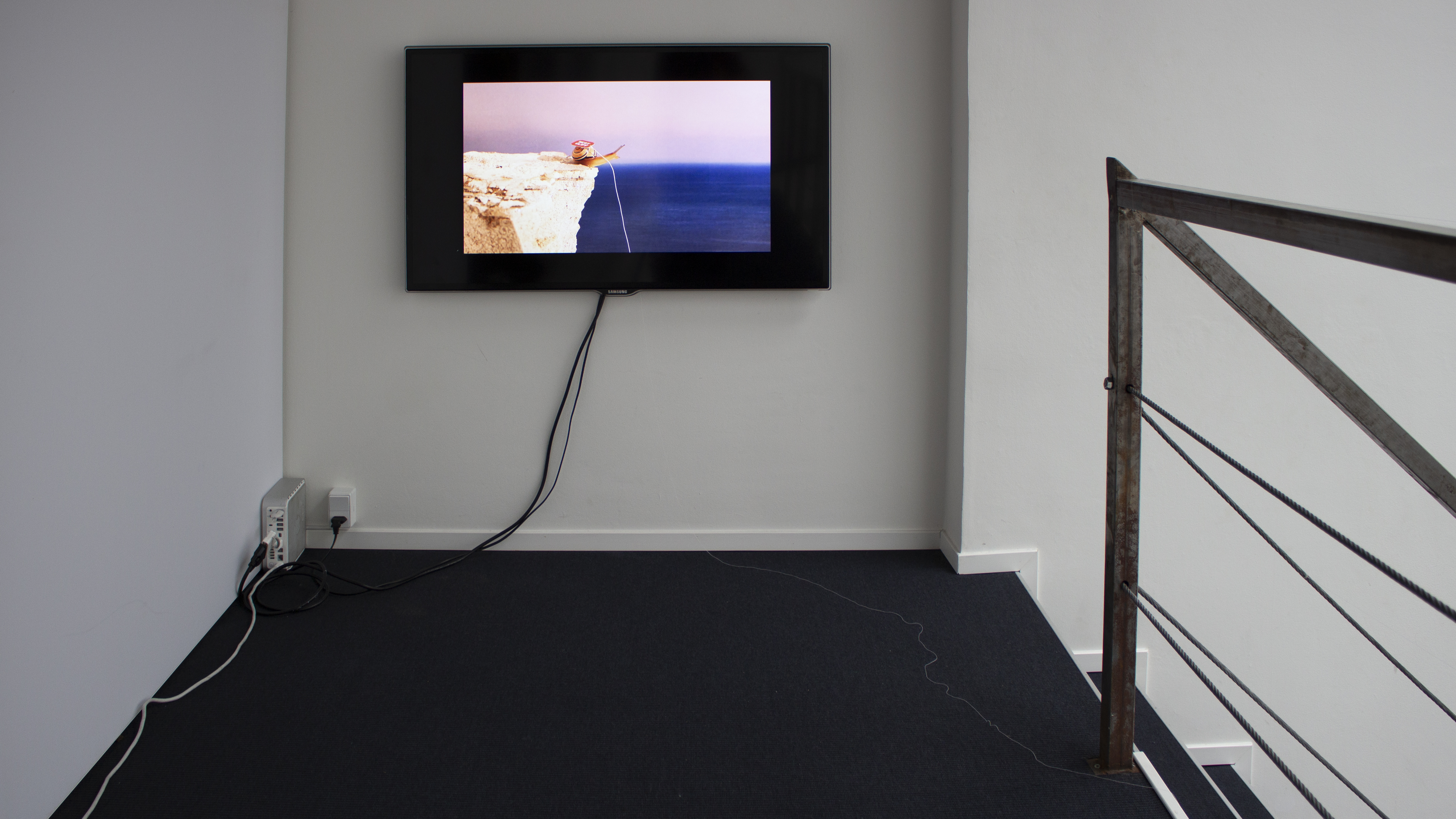 "WEST CLIFF", 2021, installation featuring video, thread, teabag, cup and saucer, 5 min loop, dimensions variable
