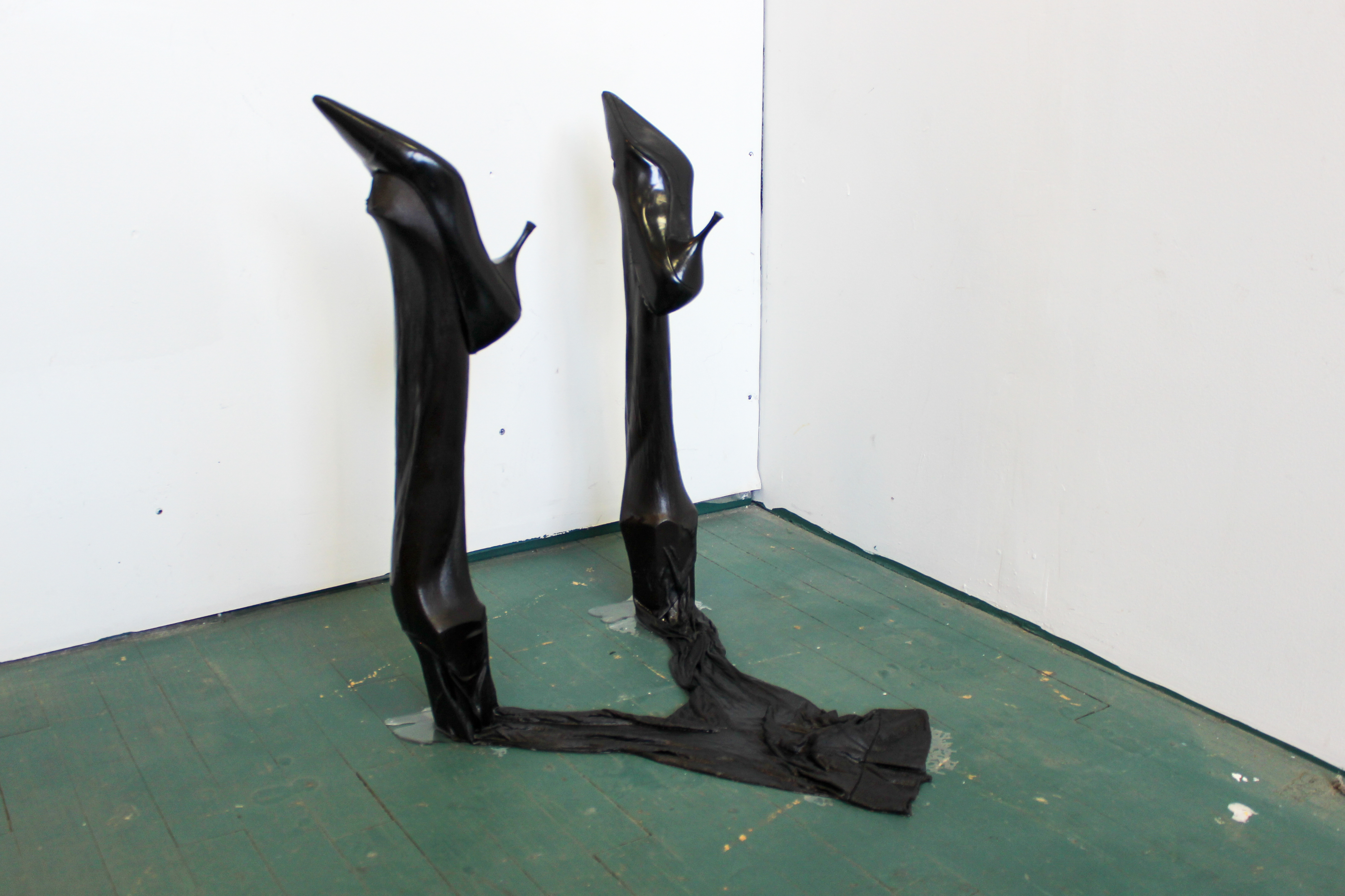 Kitty falls over, 2023, table legs, stockings, resin, shoes