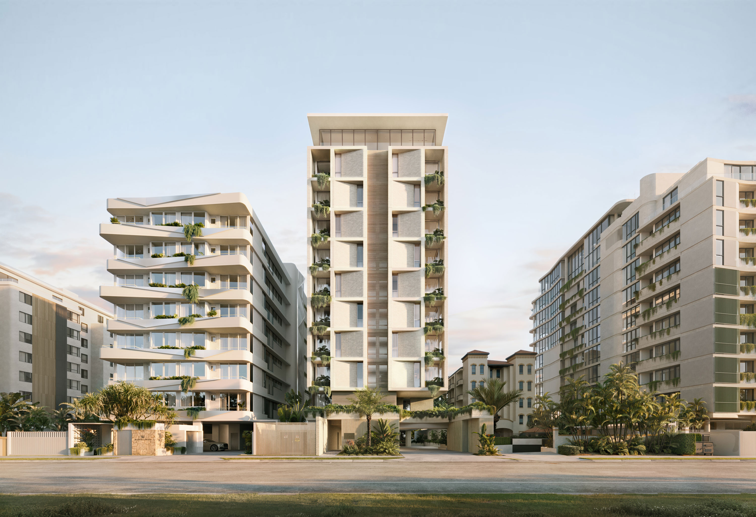Modern high-rise residential complex with three sleek towers featuring large windows, protruding balconies with greenery, and tropical landscaping along the street.