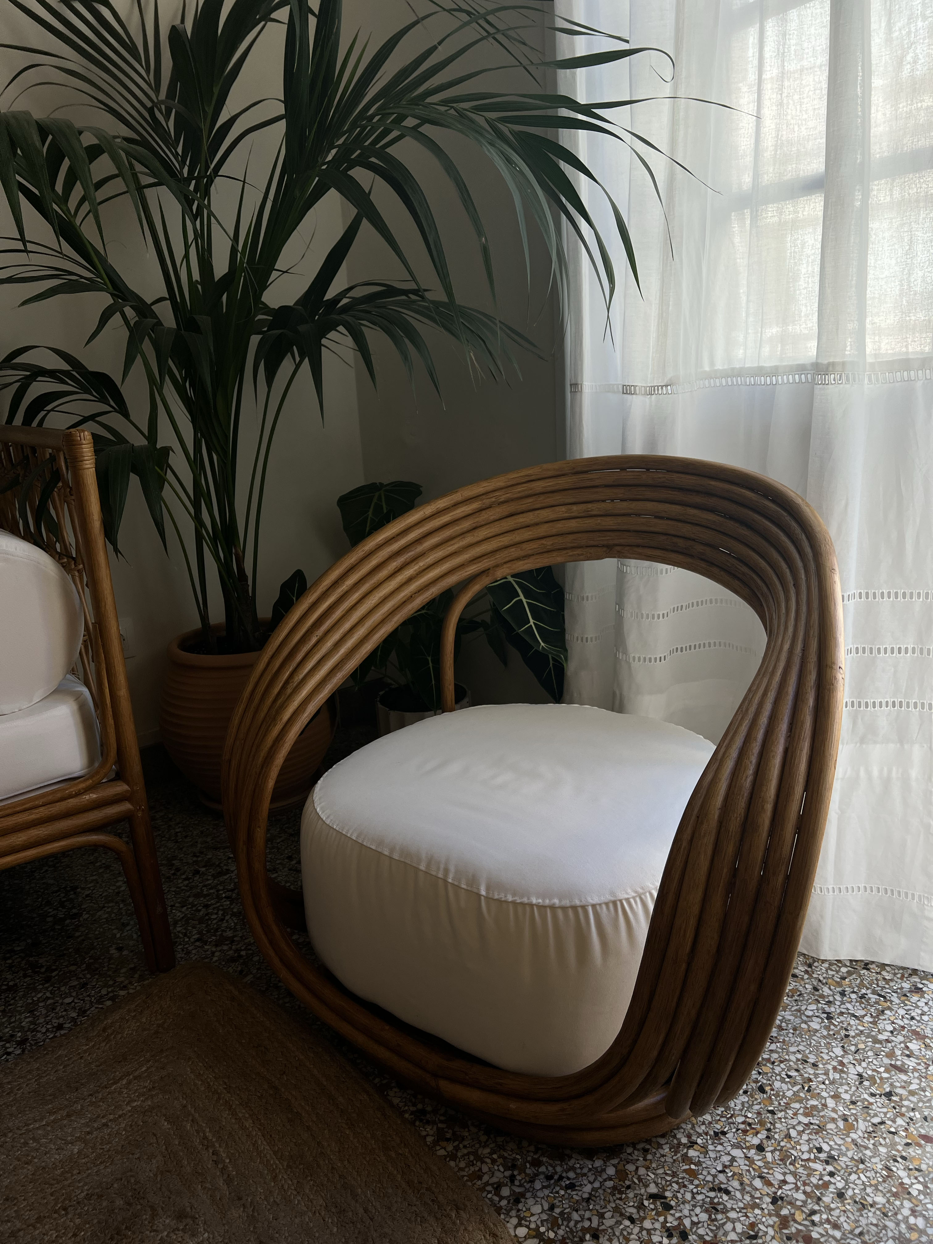 SCULPTURAL RATTAN ARMCHAIR