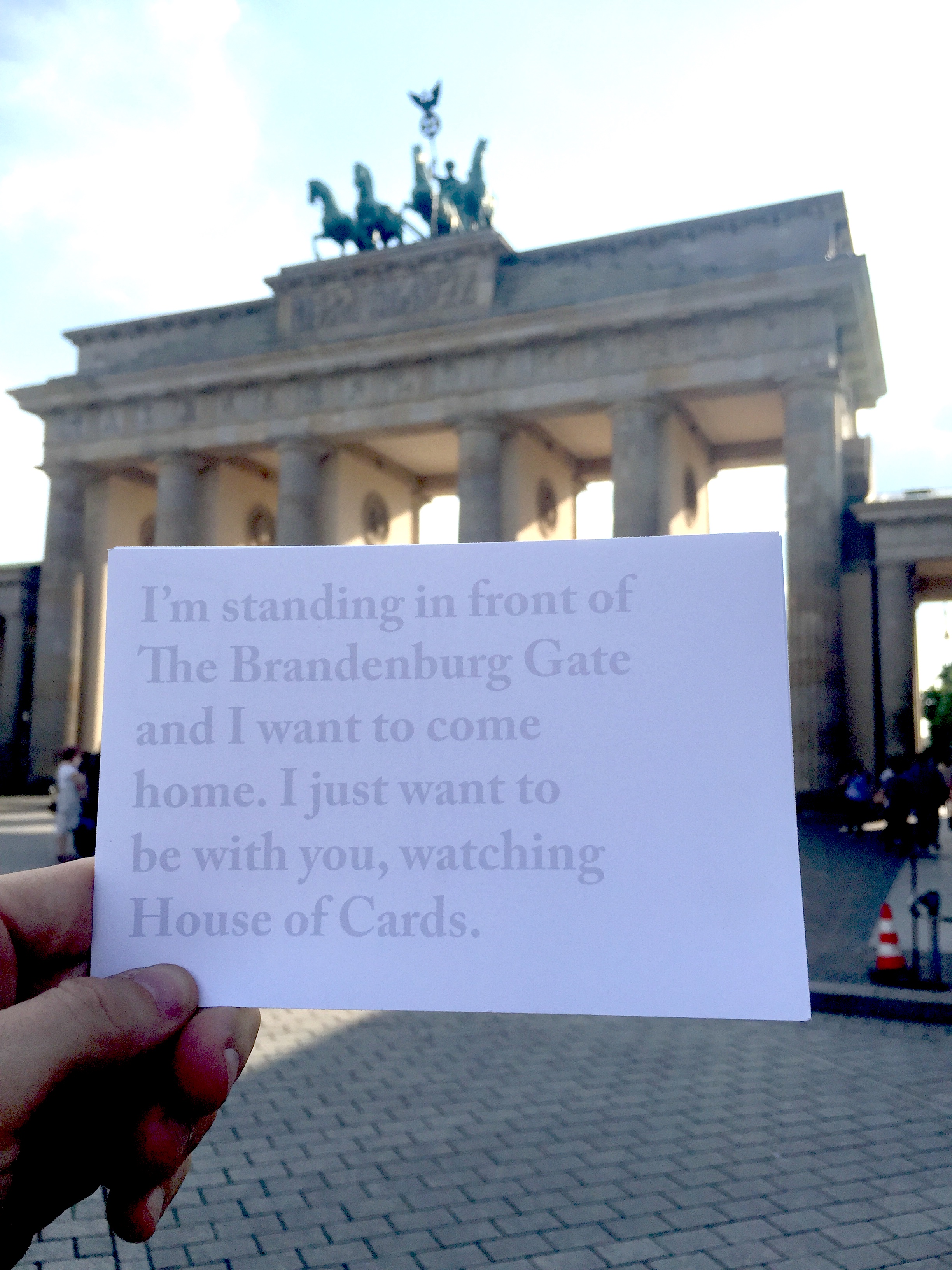 I left this card under The Brandenburg Gate. I thought another tourist might find it useful. I certainly didn't want to come home. I placed it near the Brandenburg Gate after watching a newlywed couple and their 10 or so friends pose with their Lamborghini in front of this landmark. They took pictures then got in their cars and honked and honked all around the city. It was insane.