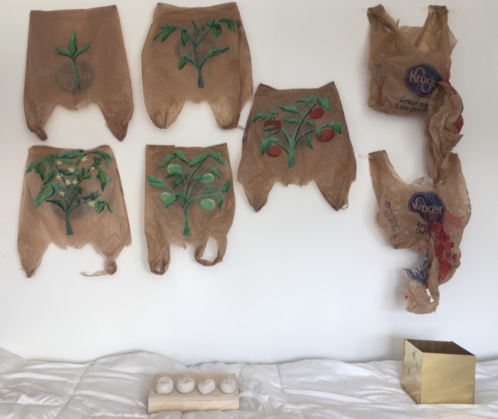 acrylic paint on grocery store bags, clay, wood, brass (2019)