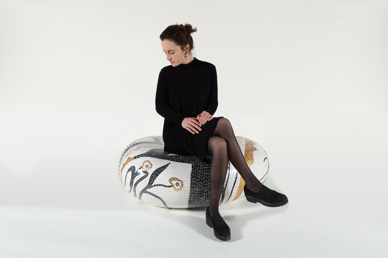 “Remote Control (black),” 2020, fiberglass, stone, grout, 41" x 31" x 16”