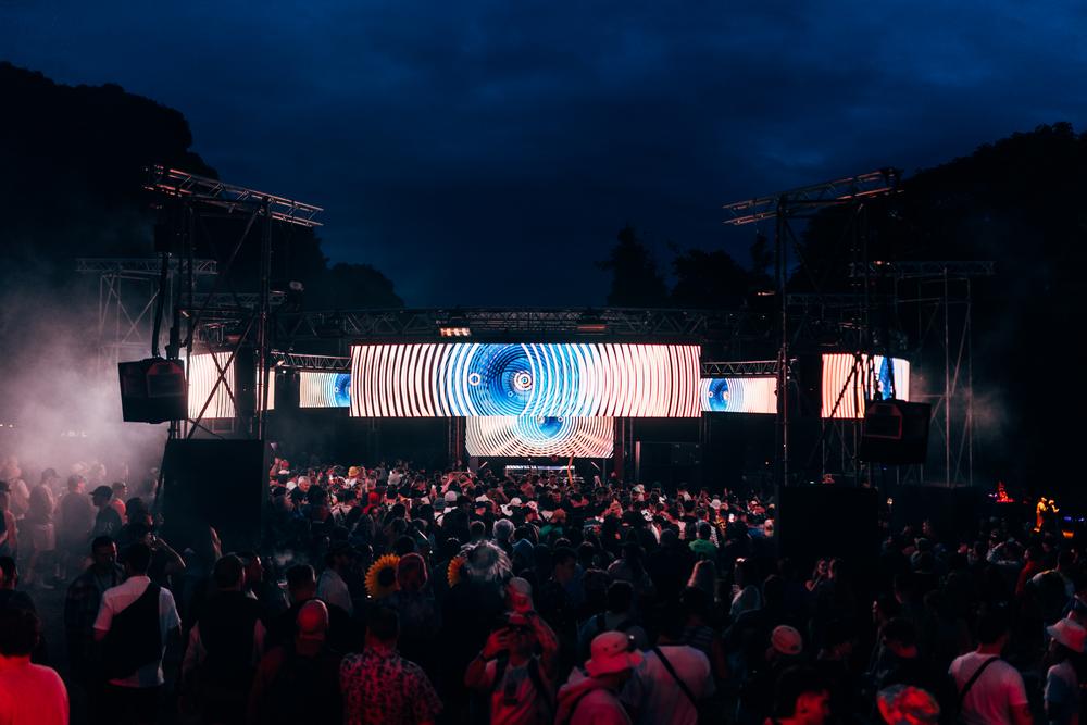Max Cooper live AV set with abstract visuals on panoramic LED screens at IMMERSE stage