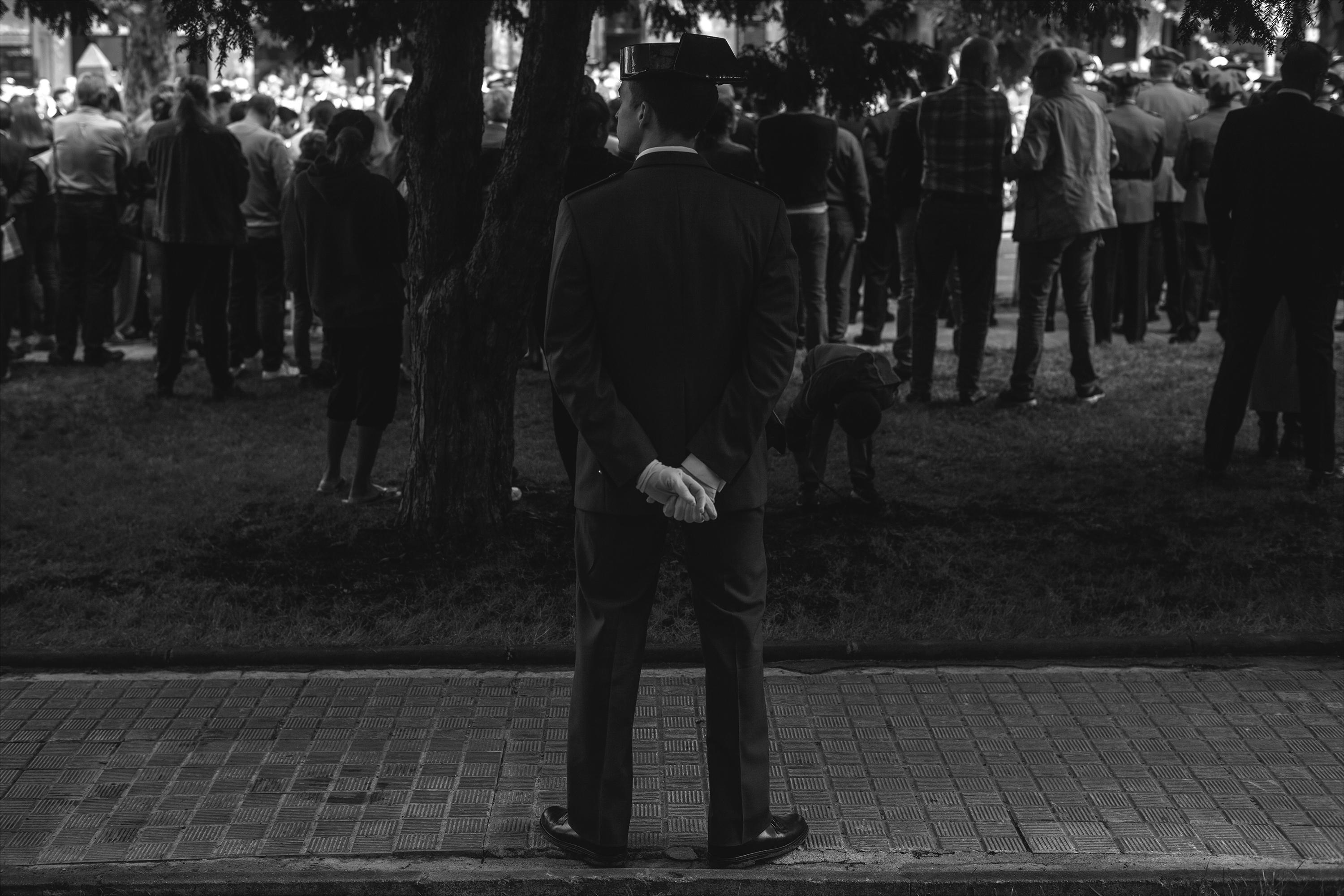 Civil Guard officer monitoring a paradePamplona, Spain, 2022photography, bw, single