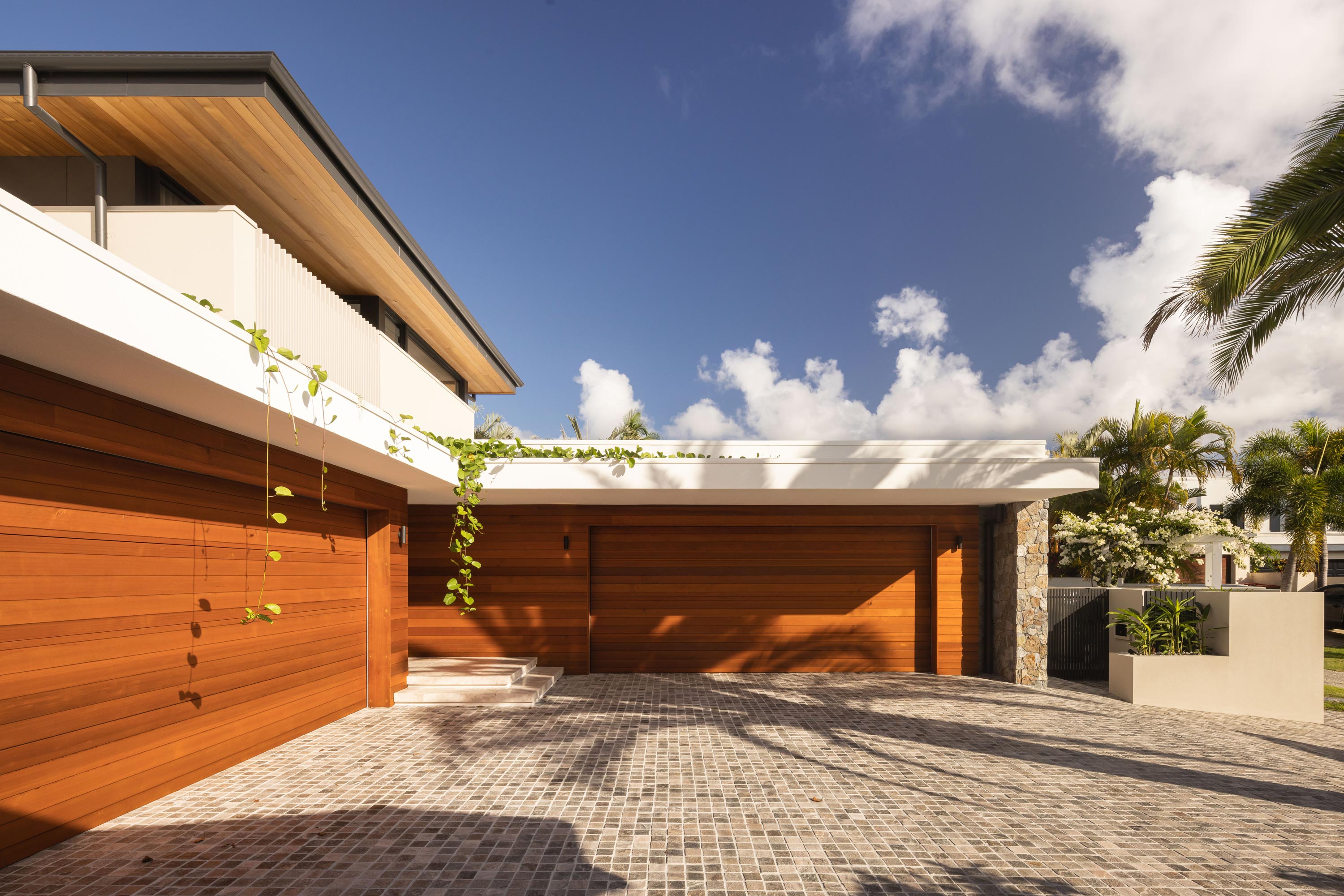 Courtyard and driveway of contemporary luxury residence in Mermaid Beach, Queensland