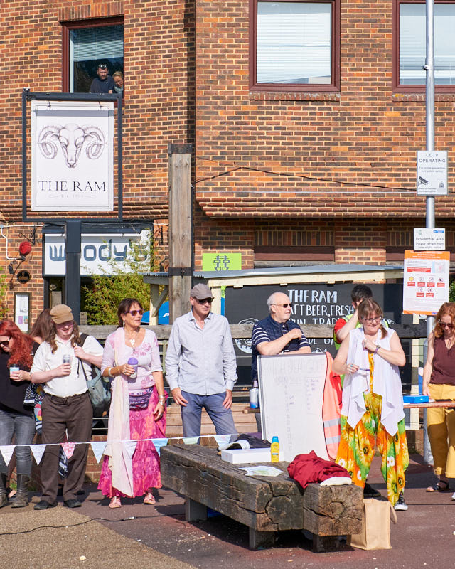 Curious spectators find all manner of vantage points to watch the event from.