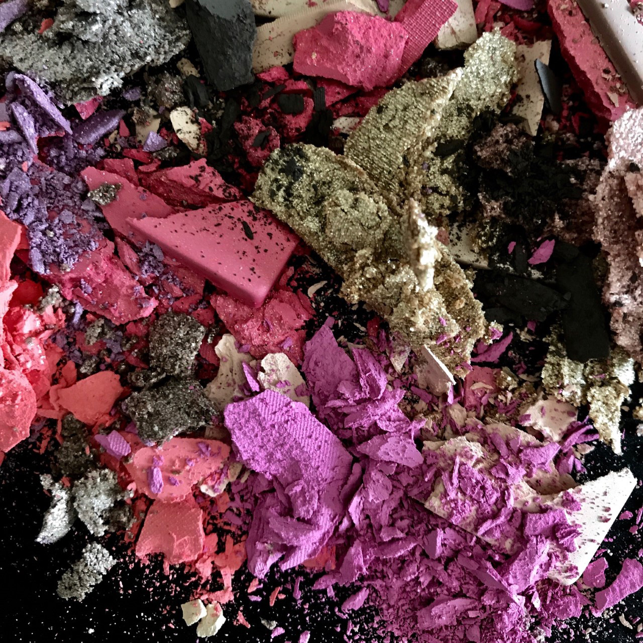 KMA stylist Rachel Haas designs set for photograph of scattered powdery and colorful eyeshadow 