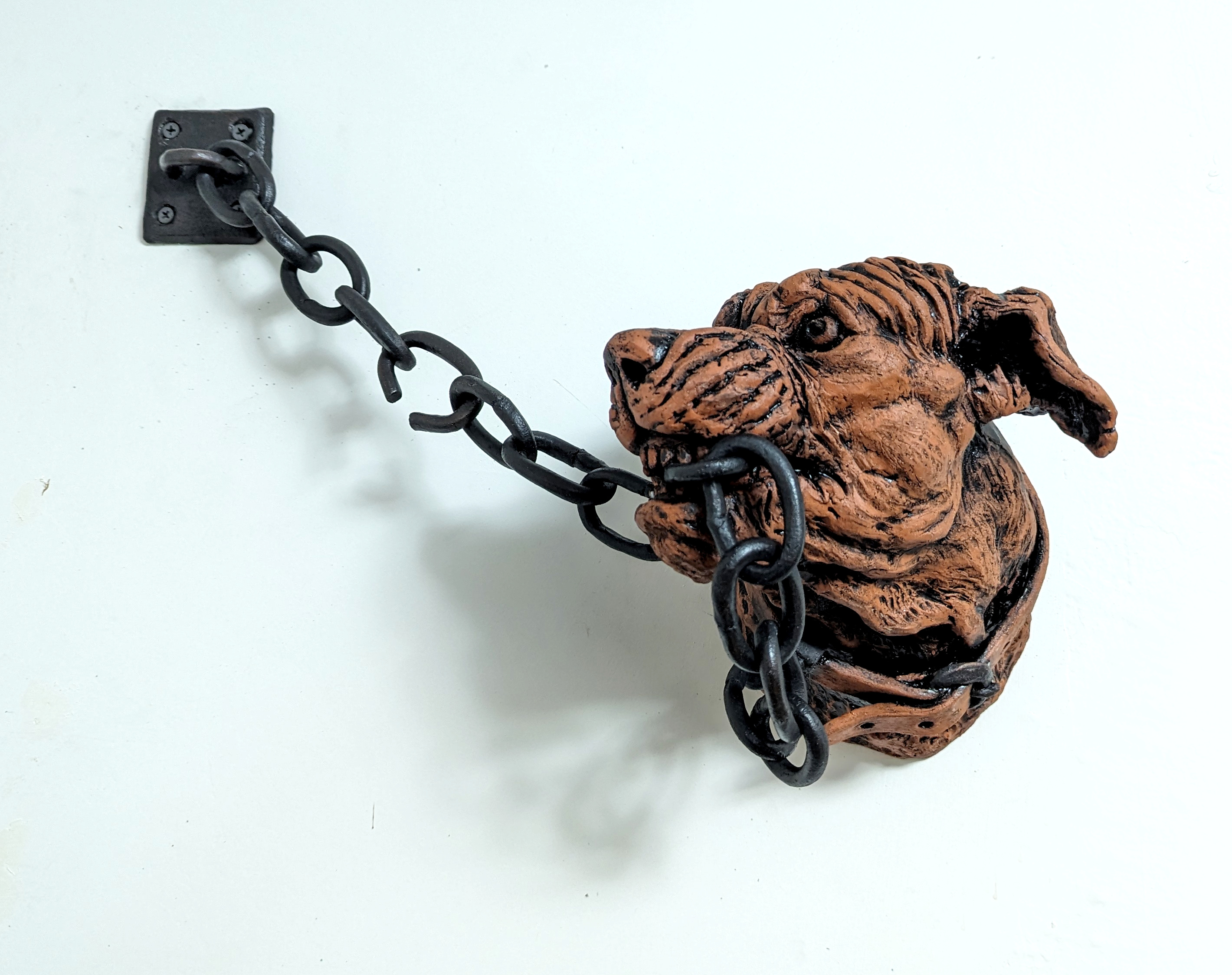 "A Barking Dog Never Bites." Terracotta, glaze, shoe polish, powdered graphite.  Dog head is approx 12"x10"x8"