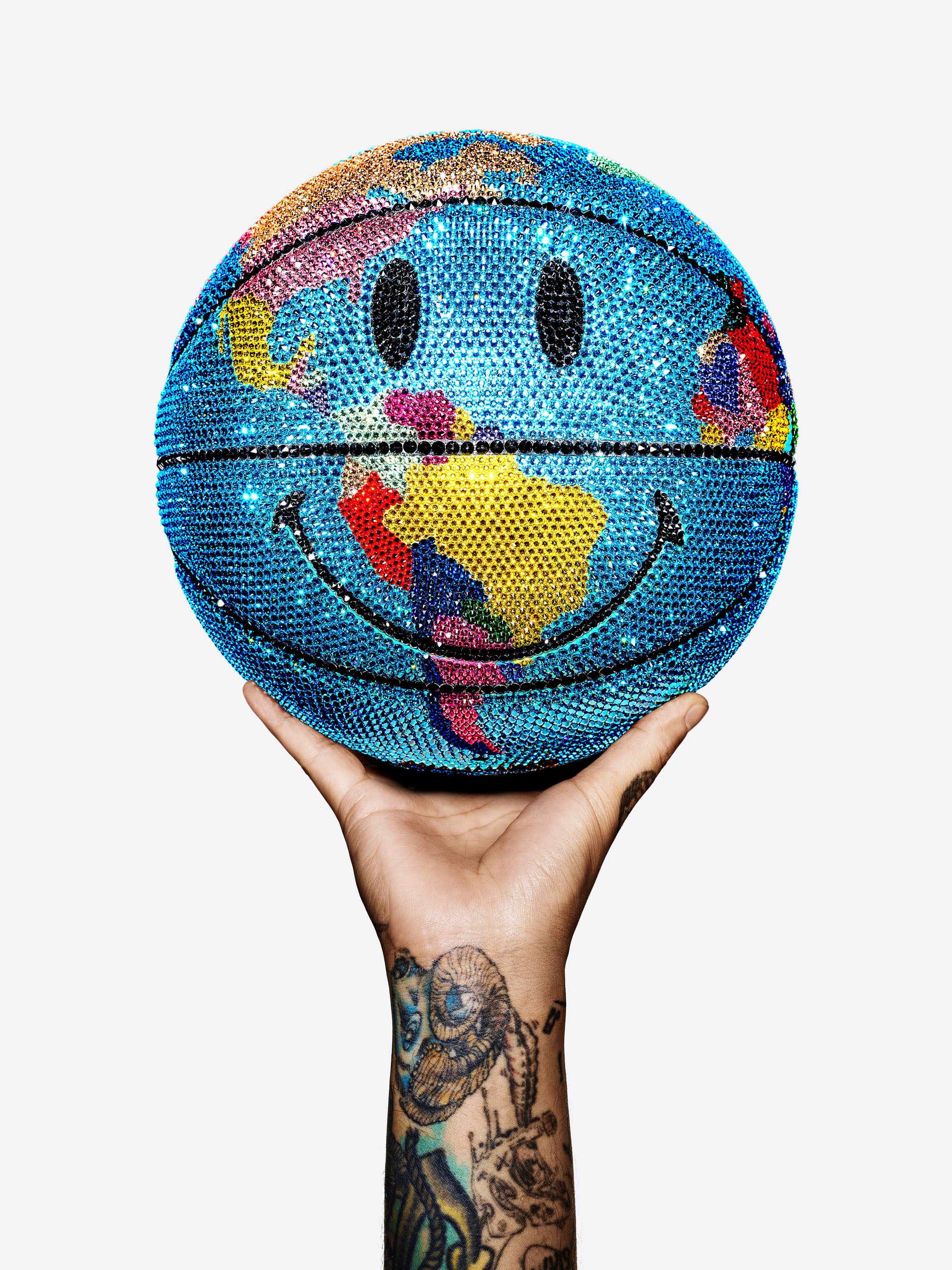KMA Stylist Mattias Nyhlin styles crystal globe smiley face for Swarovski