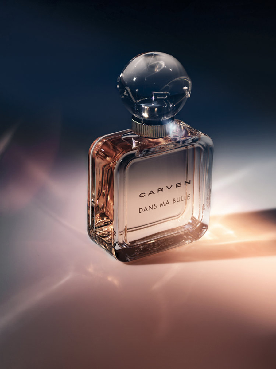 KMA stylist Rachel Haas designs set for photo of tan Carven perfume bottle for Bloomingdale's against colorful background