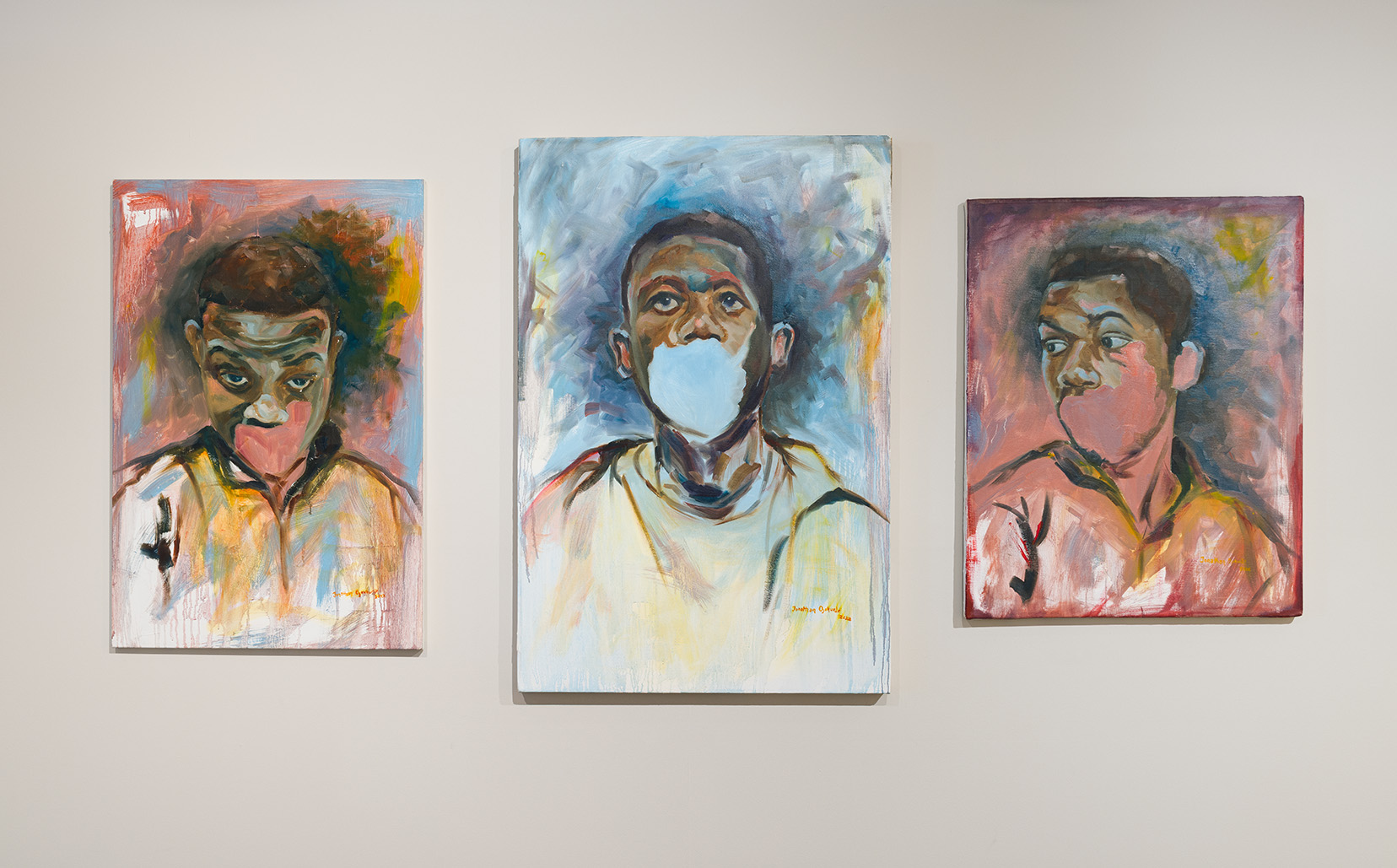 Left to Right: Jonathan Ojekunle, "I'm doing great"; "Behind the mask"; "I'm not sad", 2022, Oil on canvas, 32 x 25 inches; 36 x 34 inches; 32 x 25 inches respectively. Image by Etienne Frossard.