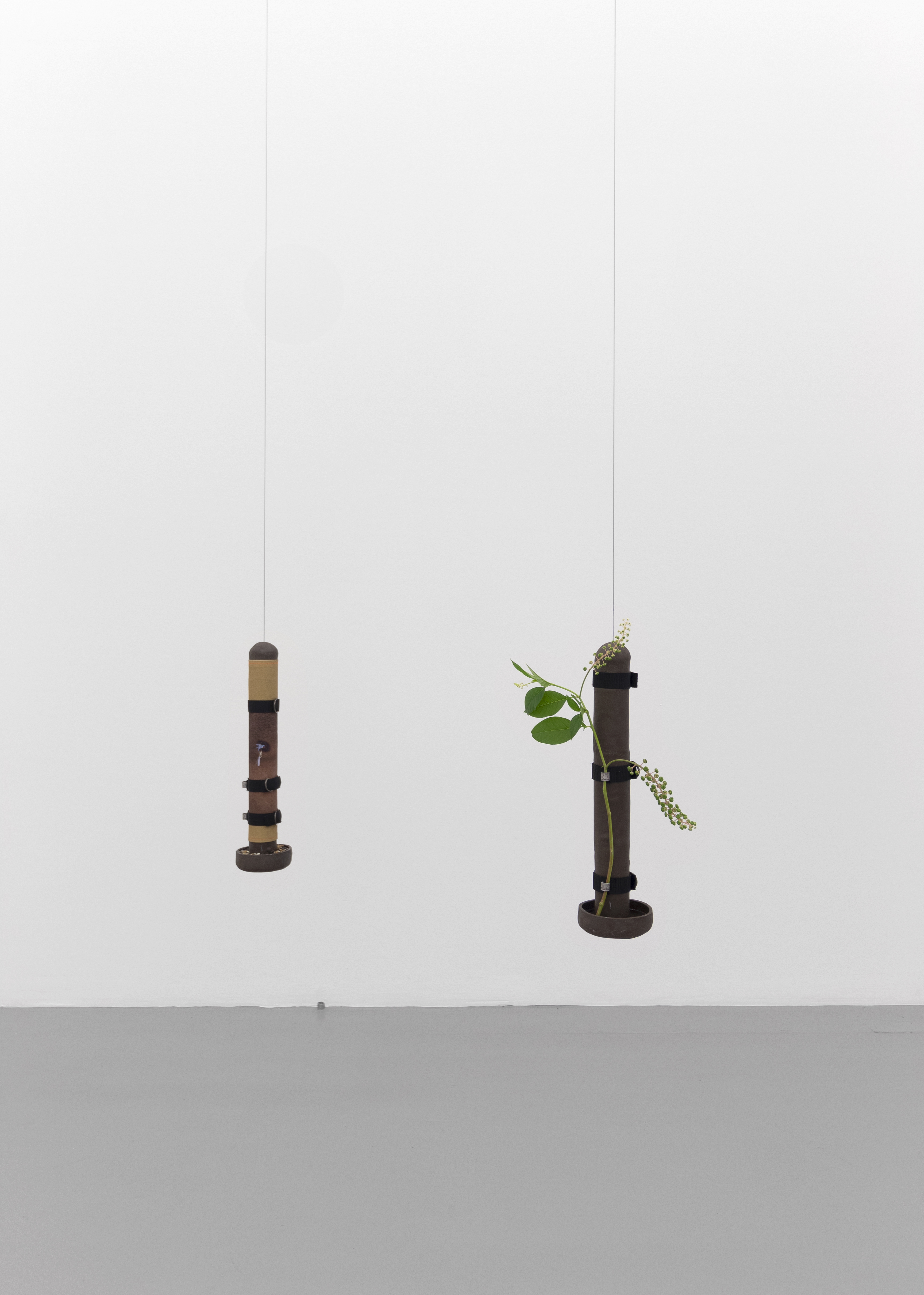 Left: Feeder No.2 Glazed ceramic, nylon straps, bird bands, water, epoxy, photographic print on bull denim, 2020. Right: Feeder No.1 Glazed ceramic, nylon straps, bird bands, water, epoxy, local plant, 2020. Photography: Prairie
