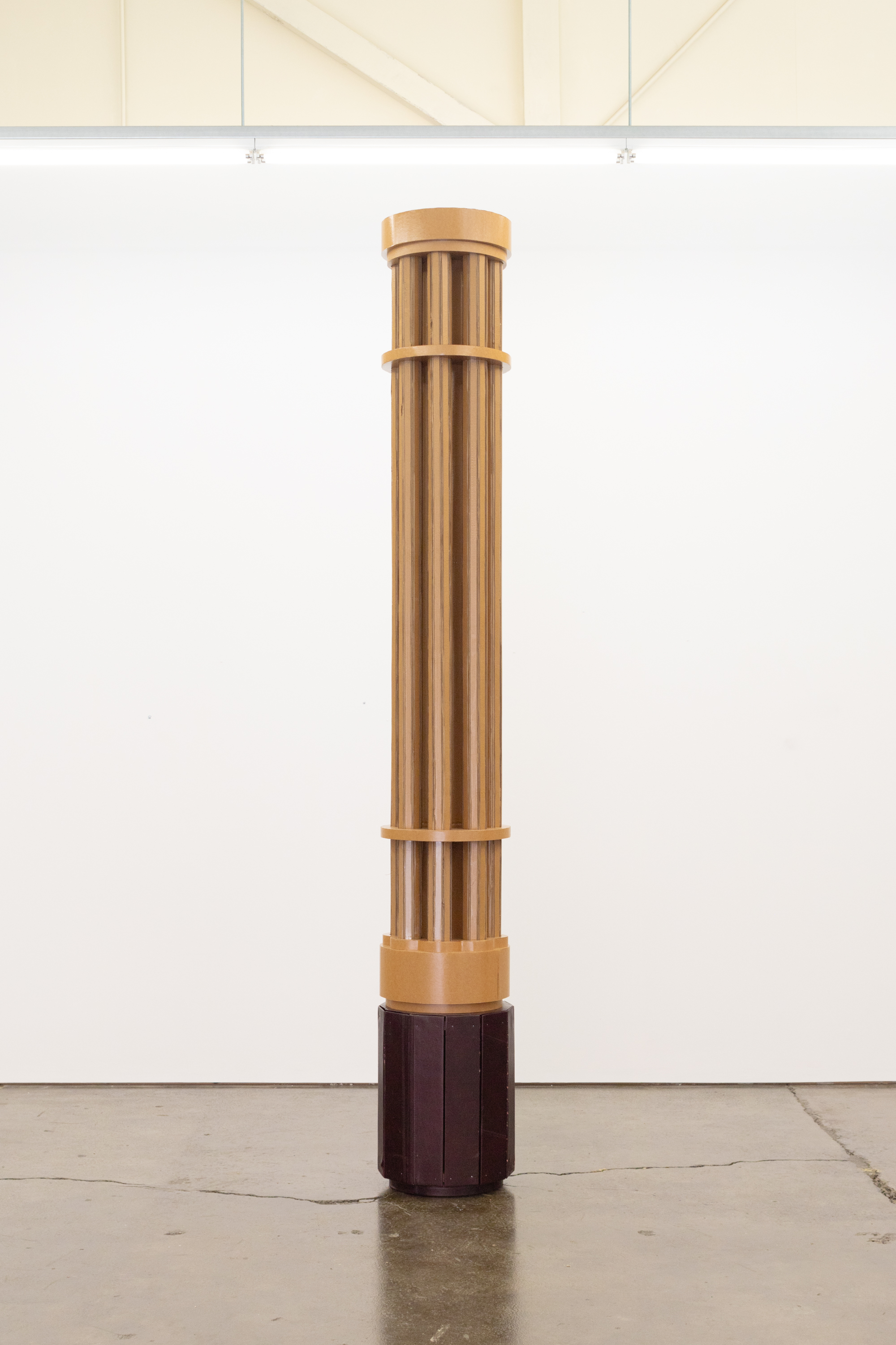 plinth, 2024, Cardboard, oil paint; pine, leather (salvaged from discarded armchair), 290 x 40 x 40 cm