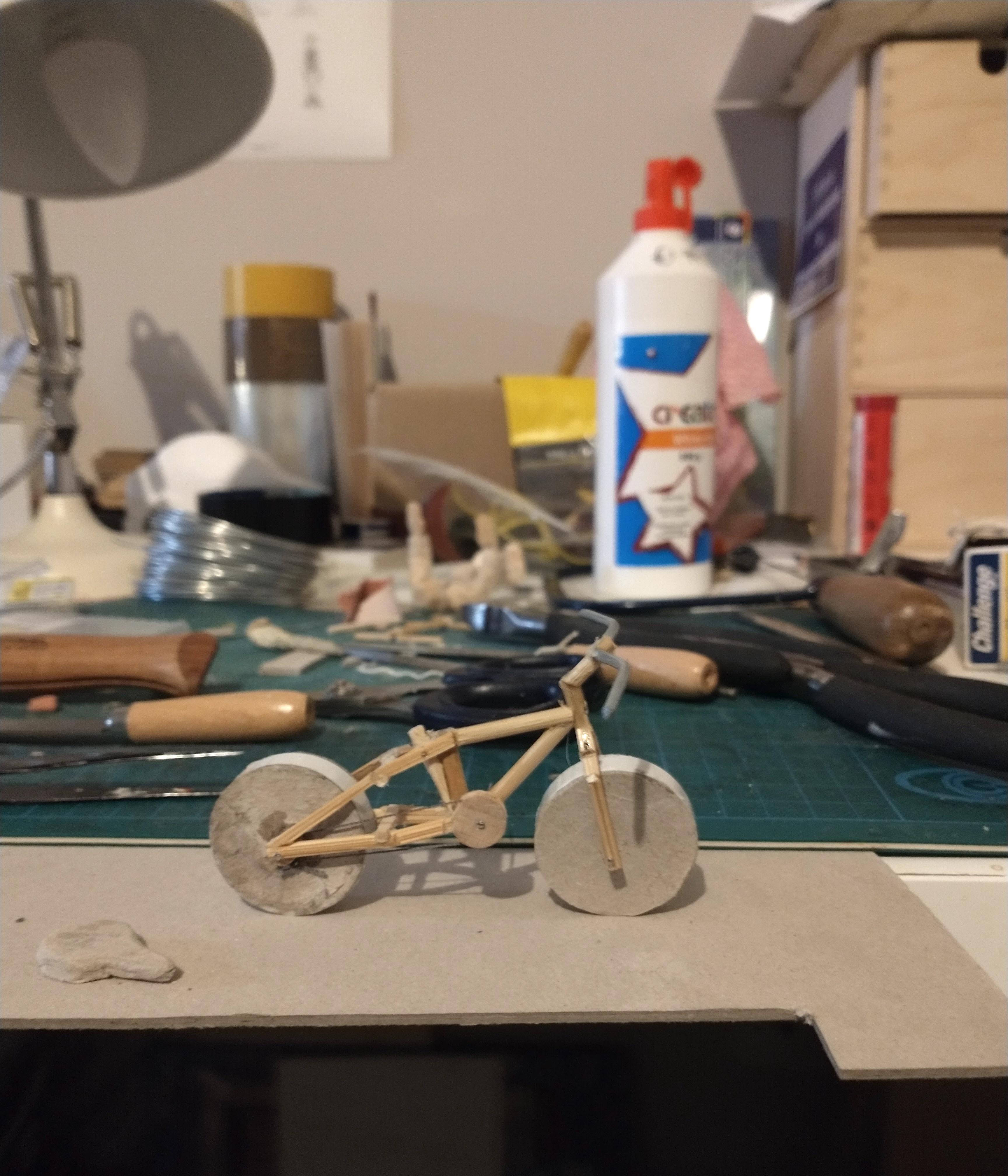 Making the bicycle from card & bamboo skewers