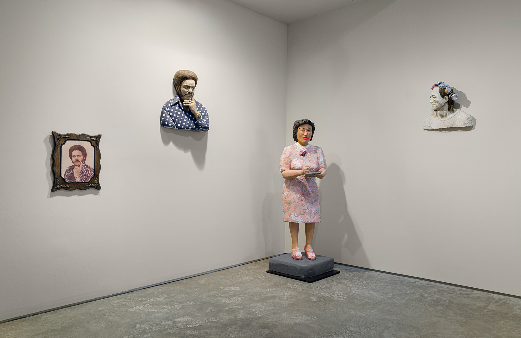 From left to right: Eduardo Estevez, "Portrait of Mr. Ed," 1968, photo on wood, 20 x 16 x 1 inches; John Ahearn, "Mr. Ed 1968," 2023, acrylic on plaster, 23 x 23 x 8 inches; Rigoberto Torres, "Julia De Burgos in Pink Dress,"  2004/2021, acrylic on reinforced aqua-resin with sequined fabric and acrylic on wood, 61 x 22 x19 inches;  John Ahearn, "Chin Chih with the Crown of Cans," 2013, acrylic on plaster with crushed cans, 18 x 19 x 8 inches. Photo by Etienne Frossard. 