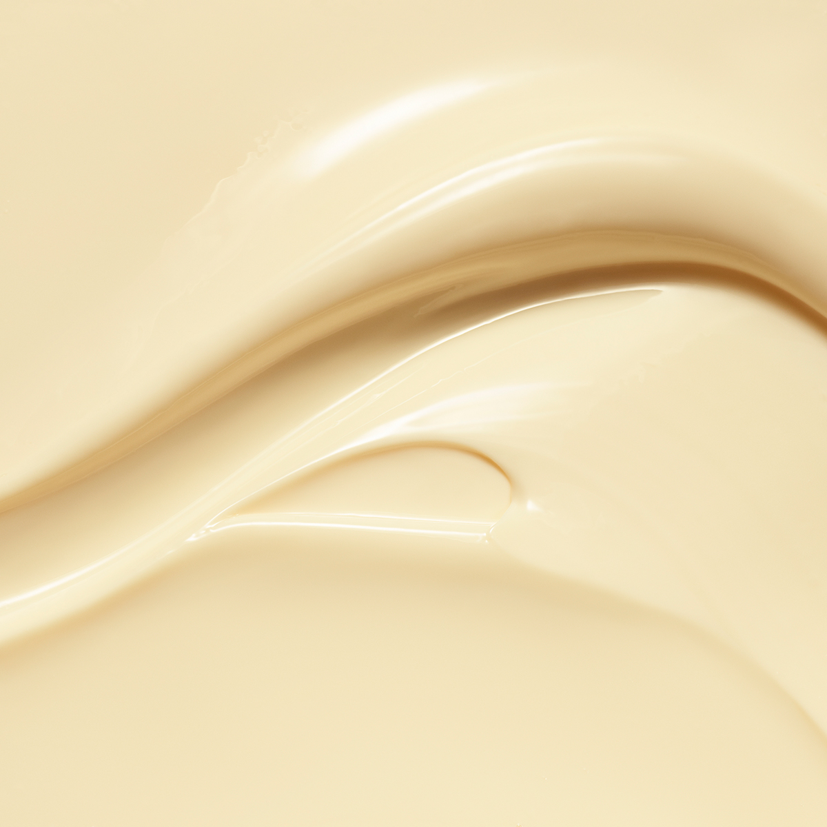 KMA photographer Isabelle Bonjean shoots a close up photograph of a creamy yellow moisturizer for beauty brand Lancome 