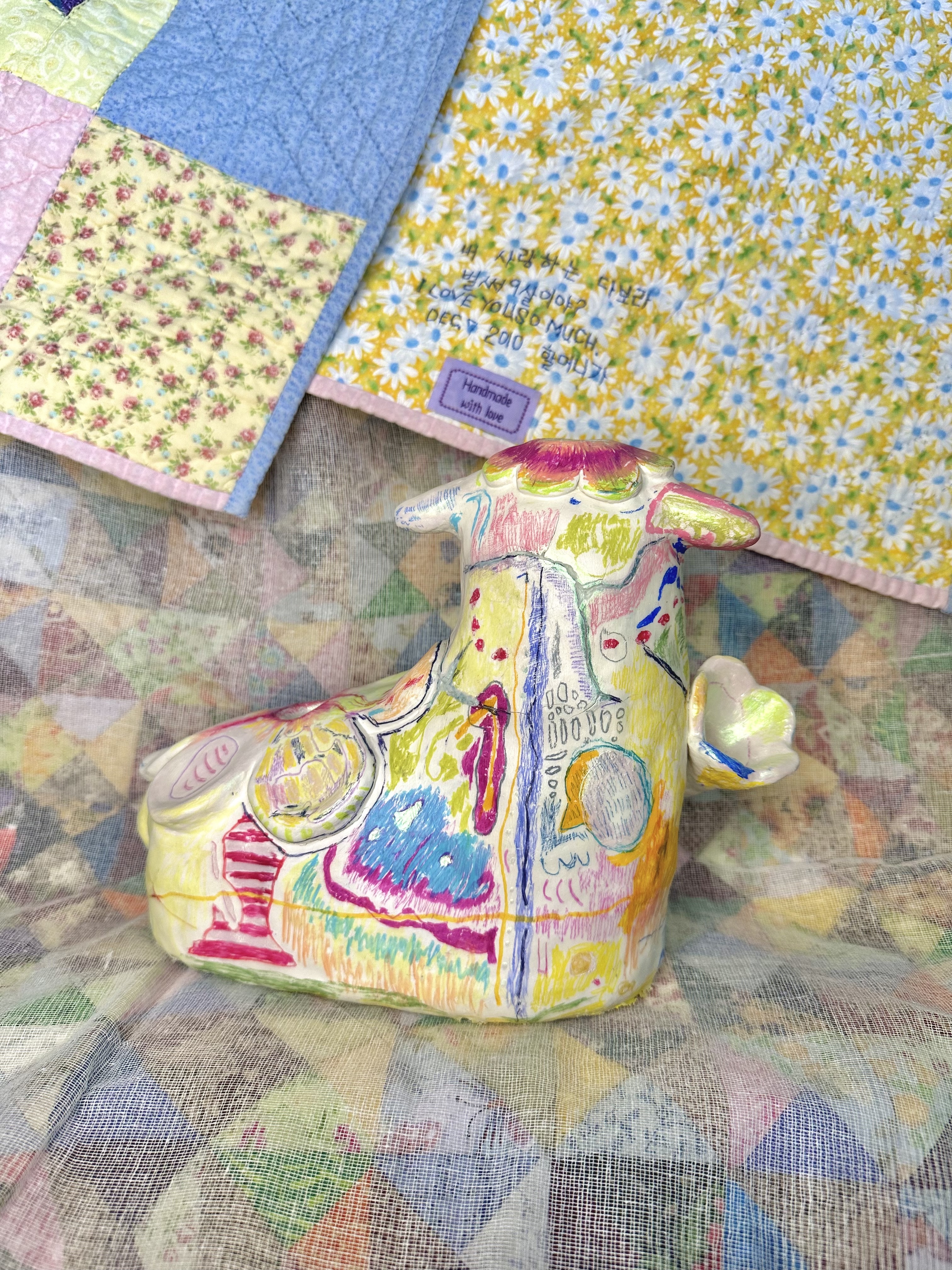 Ninth Birthday (10"x5"x8"), crayon, gel medium, and mica powder on clay