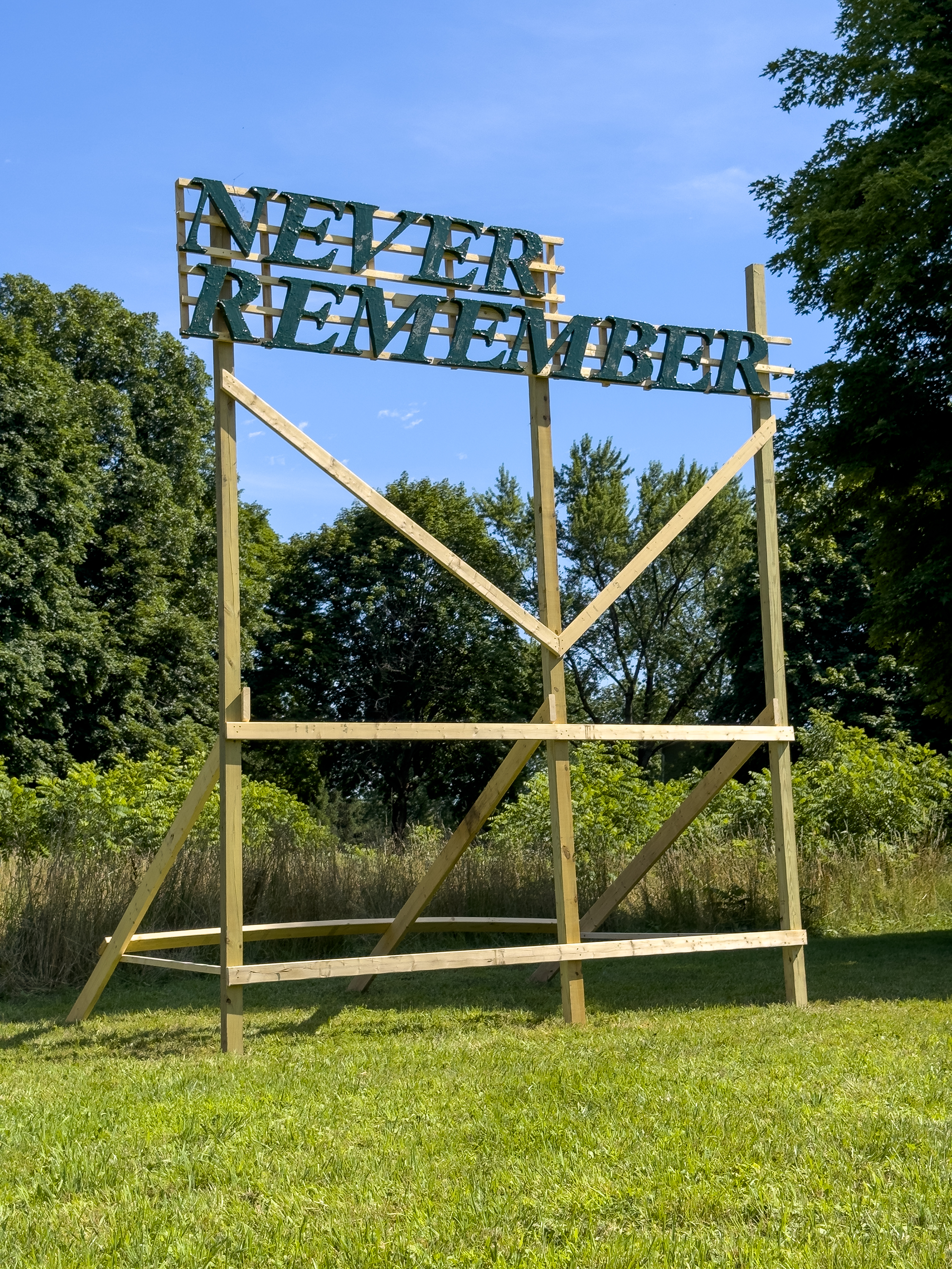 Big Decree, 2024, 180" x 144" x 120". Wood (pressure treated lumber), polystyrene foam, Aqua-Resin, steel hardware, enamel paint