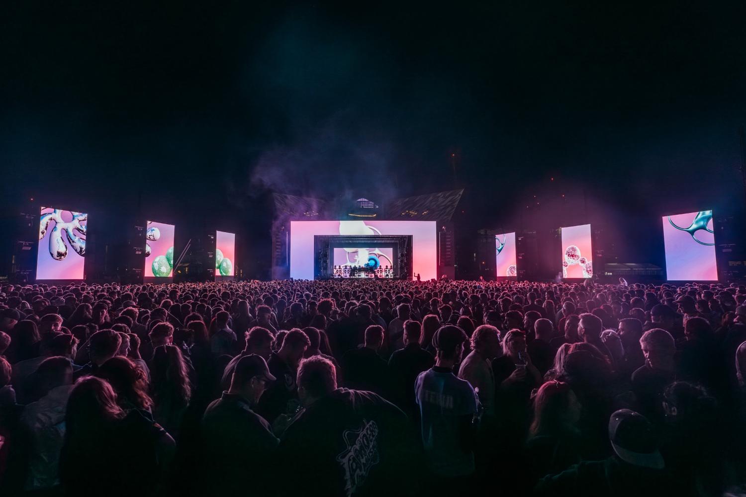 Main stage at AVA Festival 2025 lit with digital visuals and LED panels at night