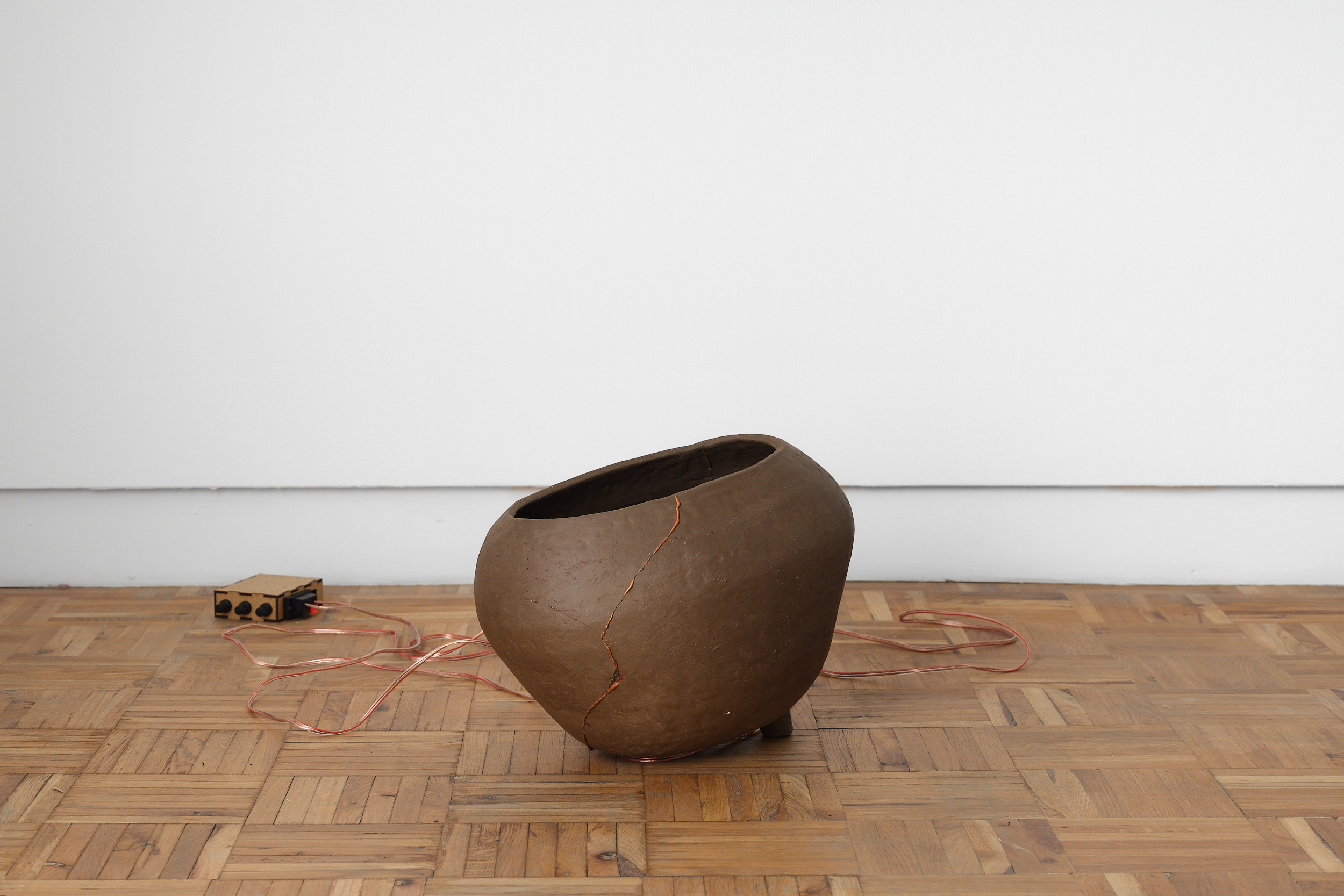 donna Kukama, Alchemies for watermelon futures (Congo) (2025) | Ceramic, epoxy resin, copper powder, speaker, audio, cables, approx. 30 x 25 x 35 cm