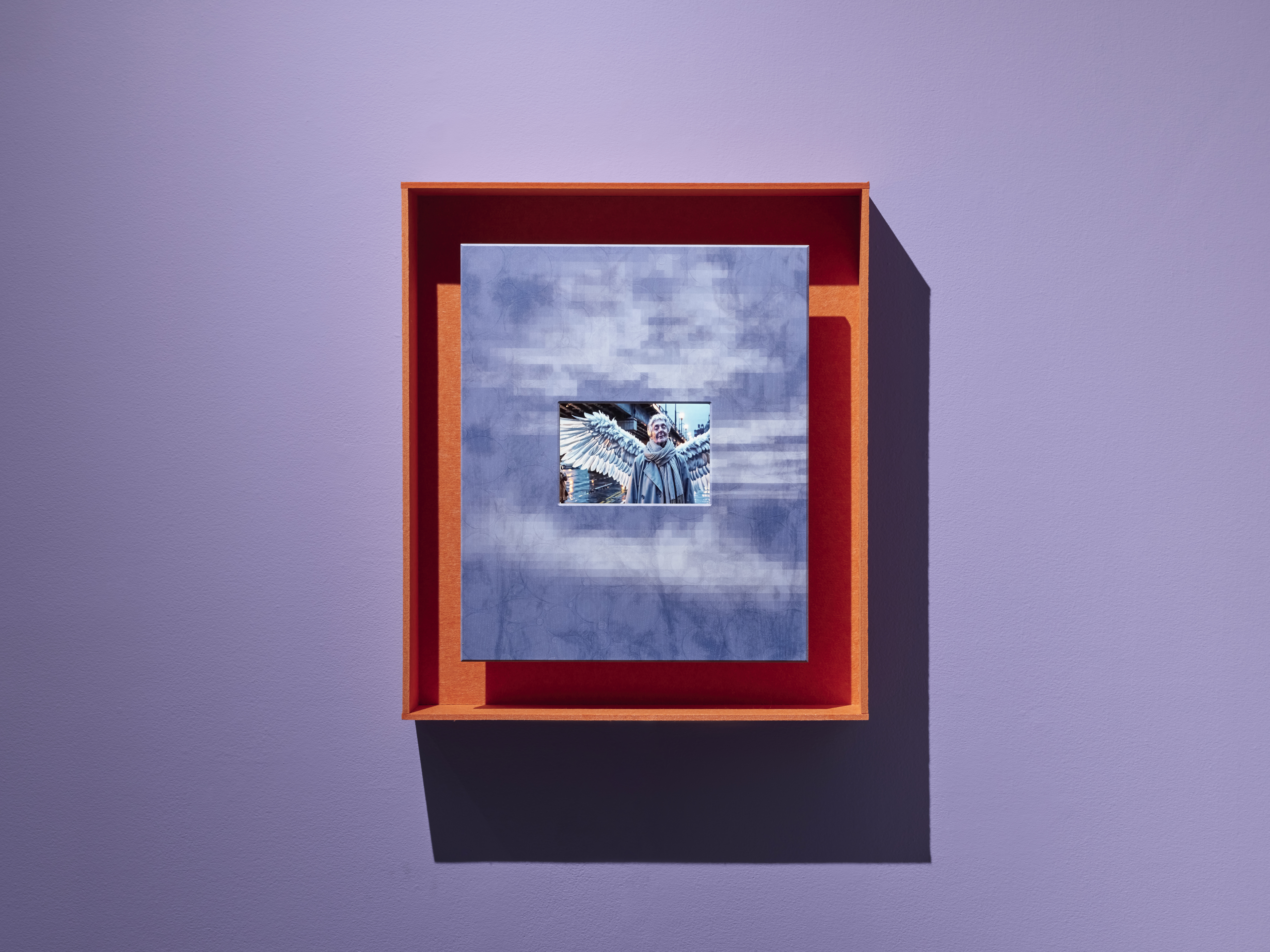 Claudia Hart Proxy Angel: 1 (Illumination), 2025 Video (color, sound), screen, media player, speaker, pigment suspended in resin, acrylic paint and varnish, ash wood, felt 30.5 x 26.5 x 5 in. / 77.5 x 67.3 x 12.7 cm 2 min, loop