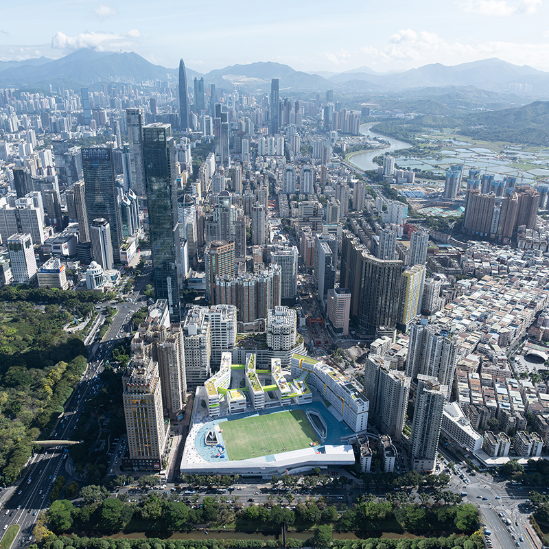 extreme urban context: skyscrapers, urban village, river and mountains of Hong Kong